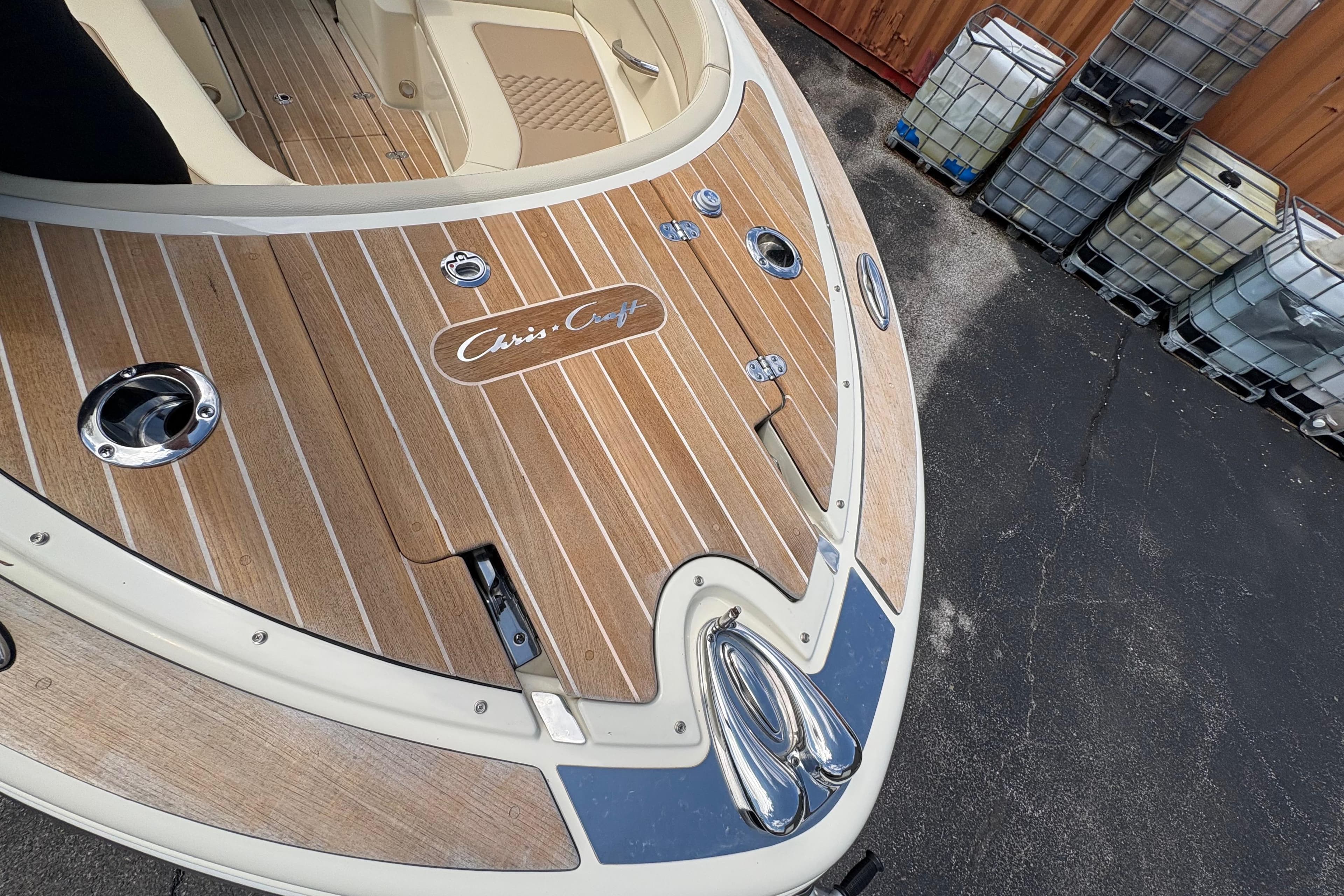 2022 Chris-Craft Launch 28 GT boat deck with elegant wood finish and chrome details.