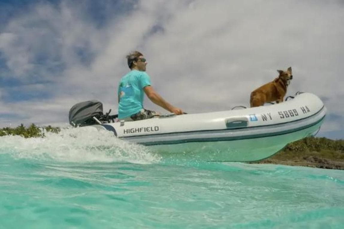 Man and dog on Highfield Classic 290 boat, 2026 model.
