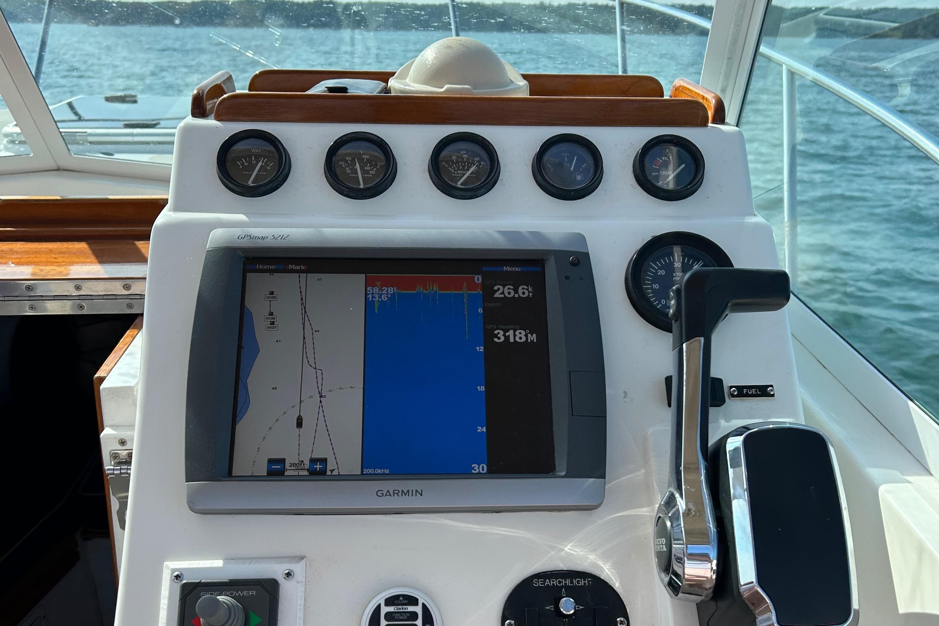 Control panel of a 2003 Surf-Hunter 25 boat with Garmin GPS display.