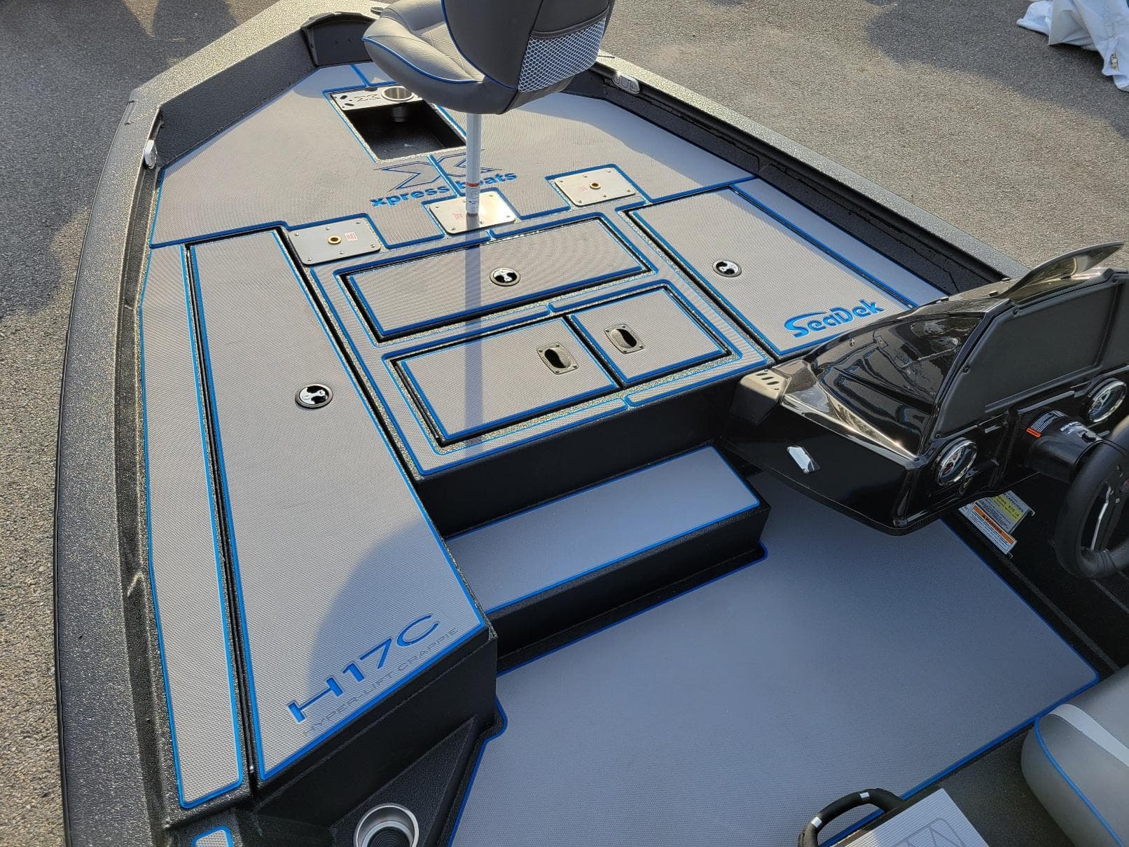 2025 Xpress H17C Crappie boat interior with SeaDek flooring and storage compartments.