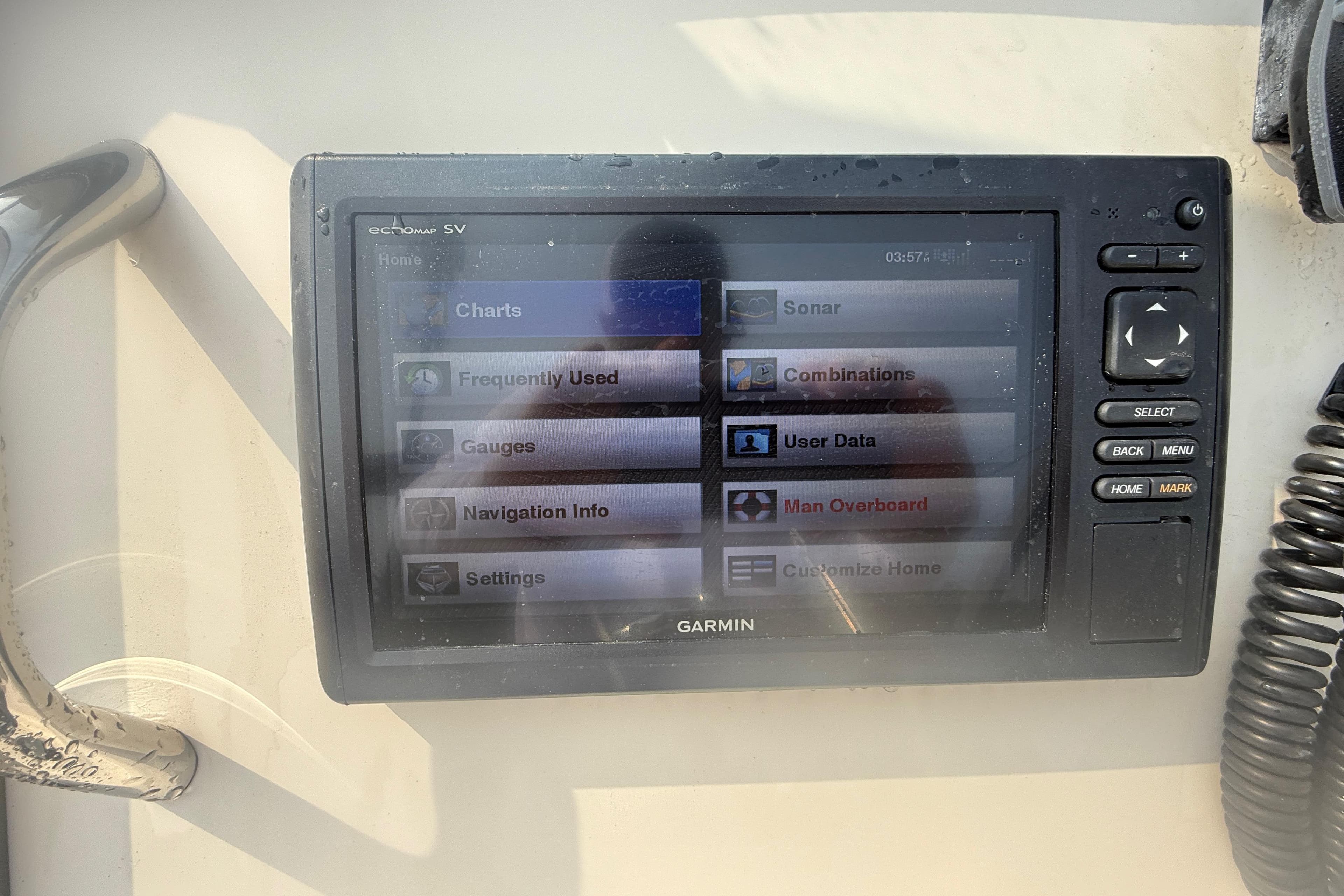 Garmin marine GPS display on 2017 Grady-White Freedom 235 boat, showing navigation options.
