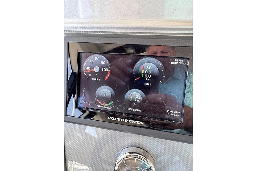 Dashboard of a 2012 Marquis 500 Sport Bridge with Volvo Penta display showing gauges.