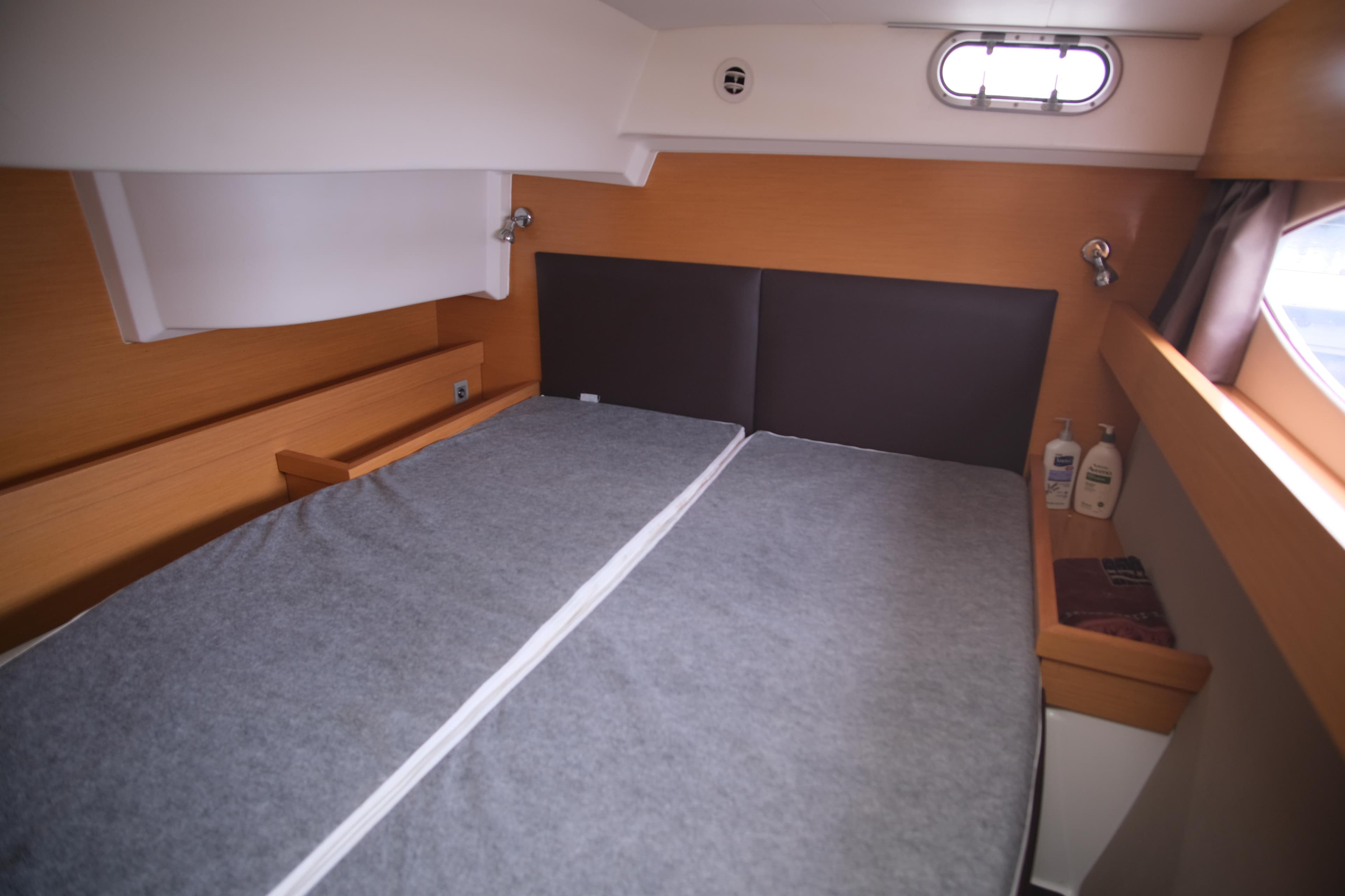 2011 Fountaine Pajot Salina 48 Evolution Maestro cabin interior with bed and window.