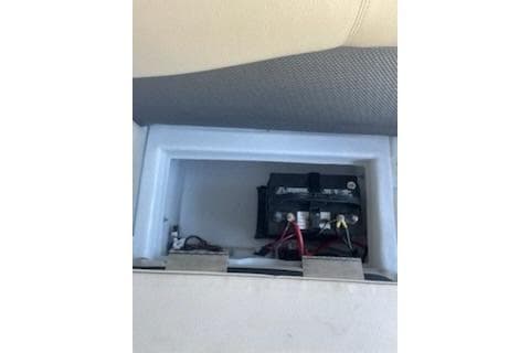 2023 PlayCraft 27 Infinity boat battery compartment with wiring.