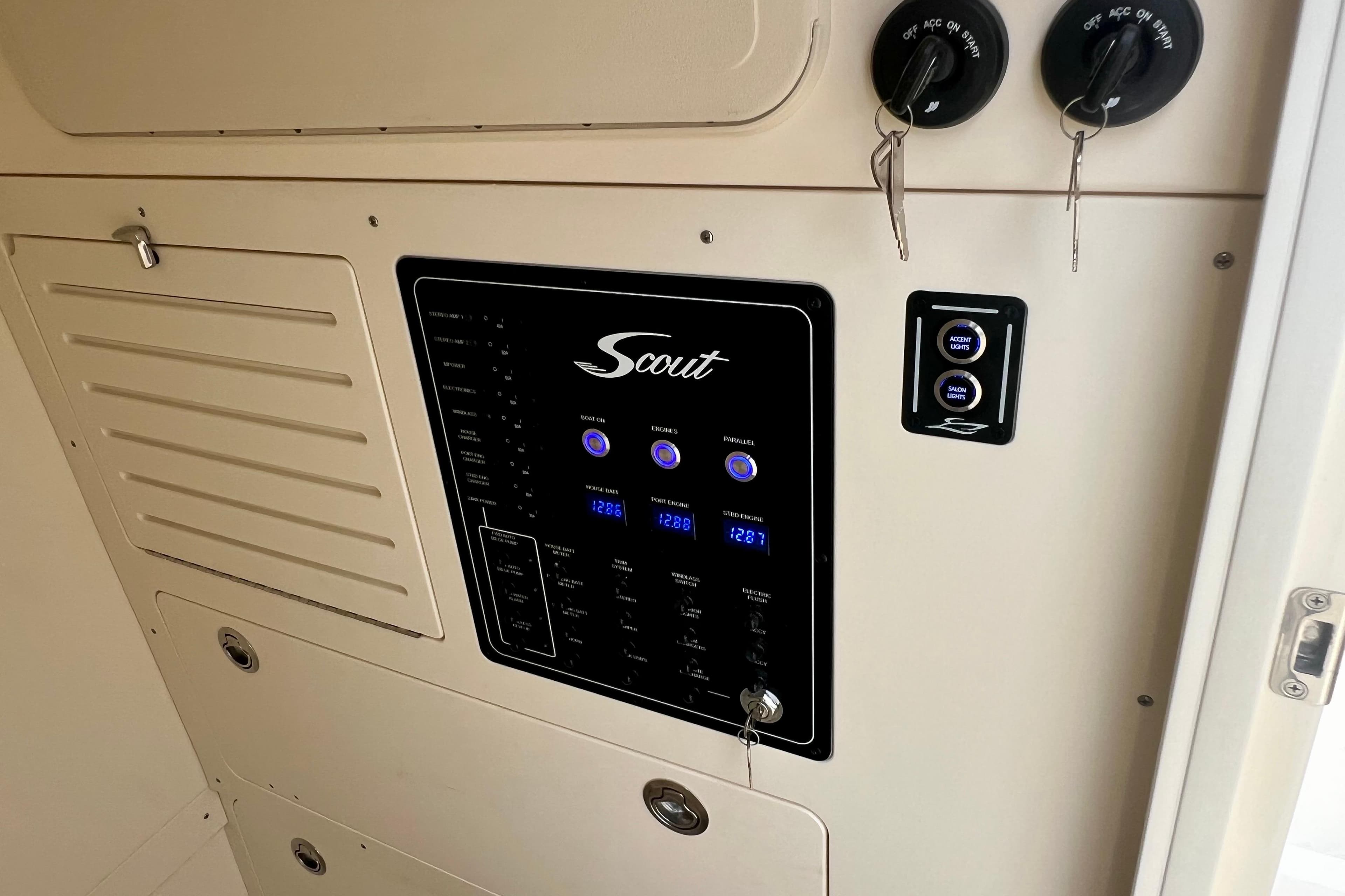 Control panel of 2026 Scout 288 LXF boat with switches and keys.