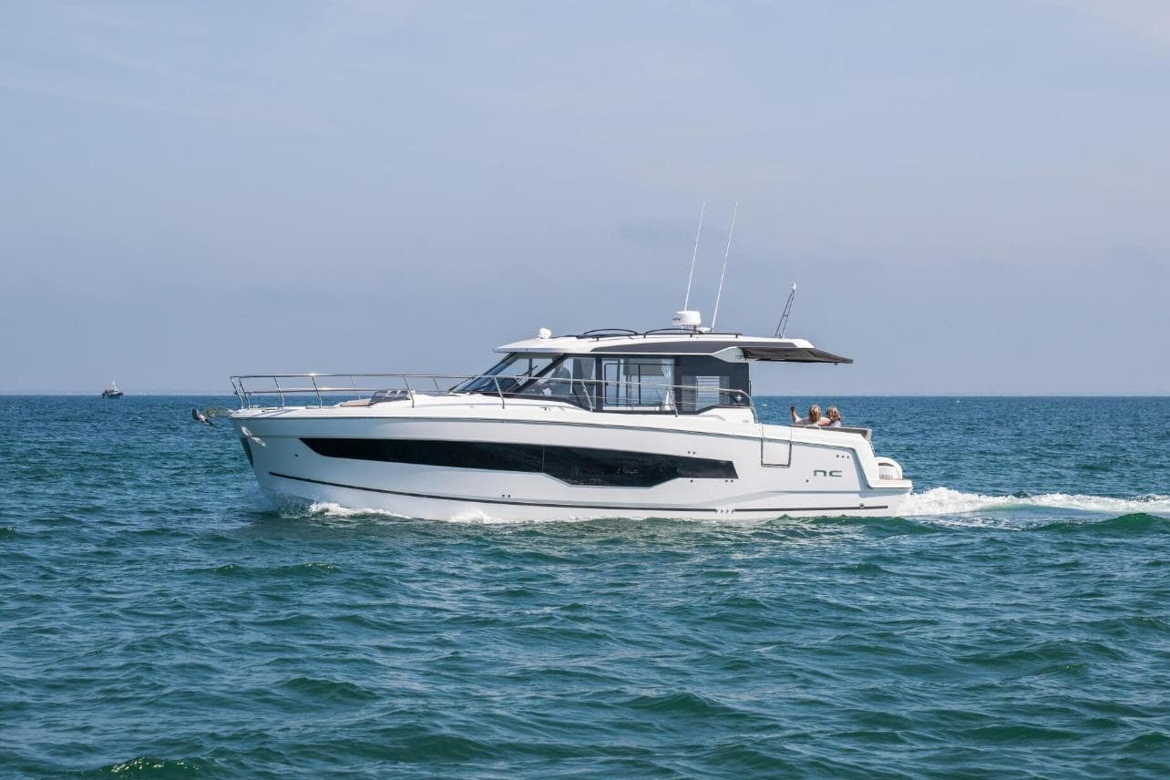 2026 Jeanneau NC 1295 Weekender cruising on open water.