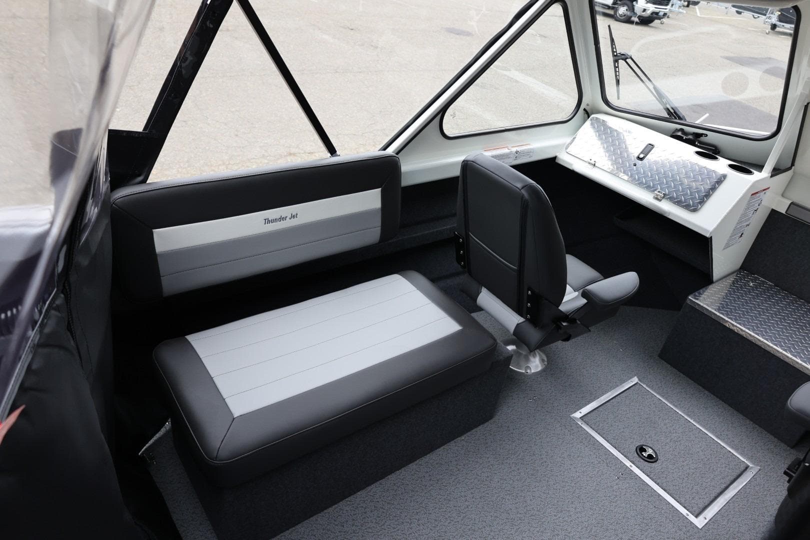 Interior of 2026 Thunder Jet 200 Luxor boat with seating and control panel.