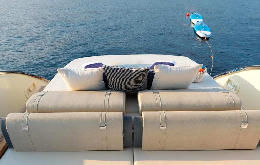 2023 Invictus TT460 yacht deck with luxurious seating and ocean view.
