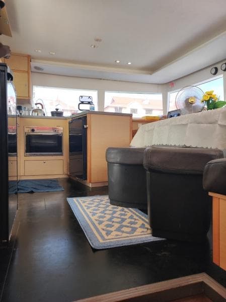 Interior of 2017 Lagoon 450S yacht with modern kitchen and seating area.
