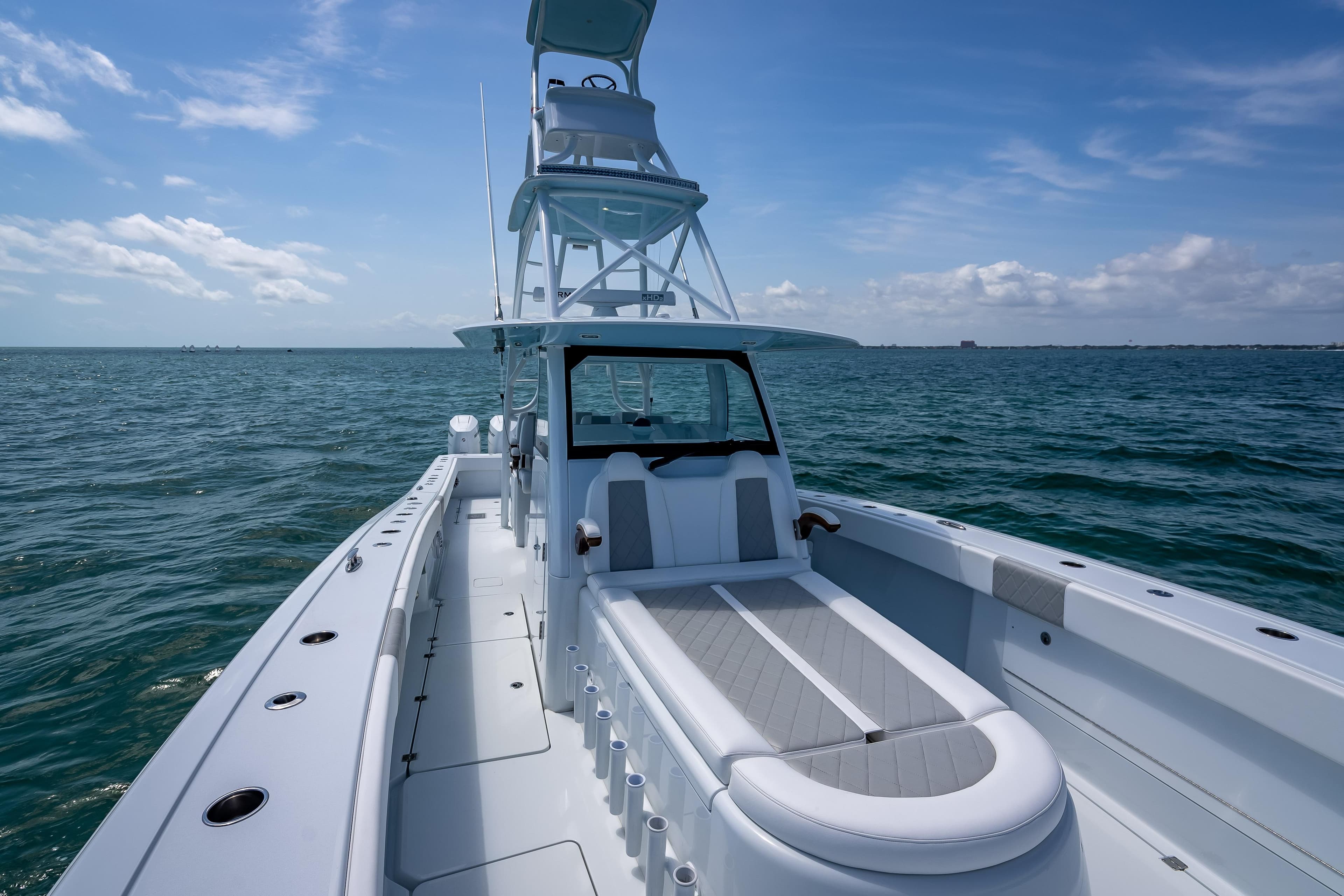 2025 Freeman 43 boat on open sea under clear blue sky.
