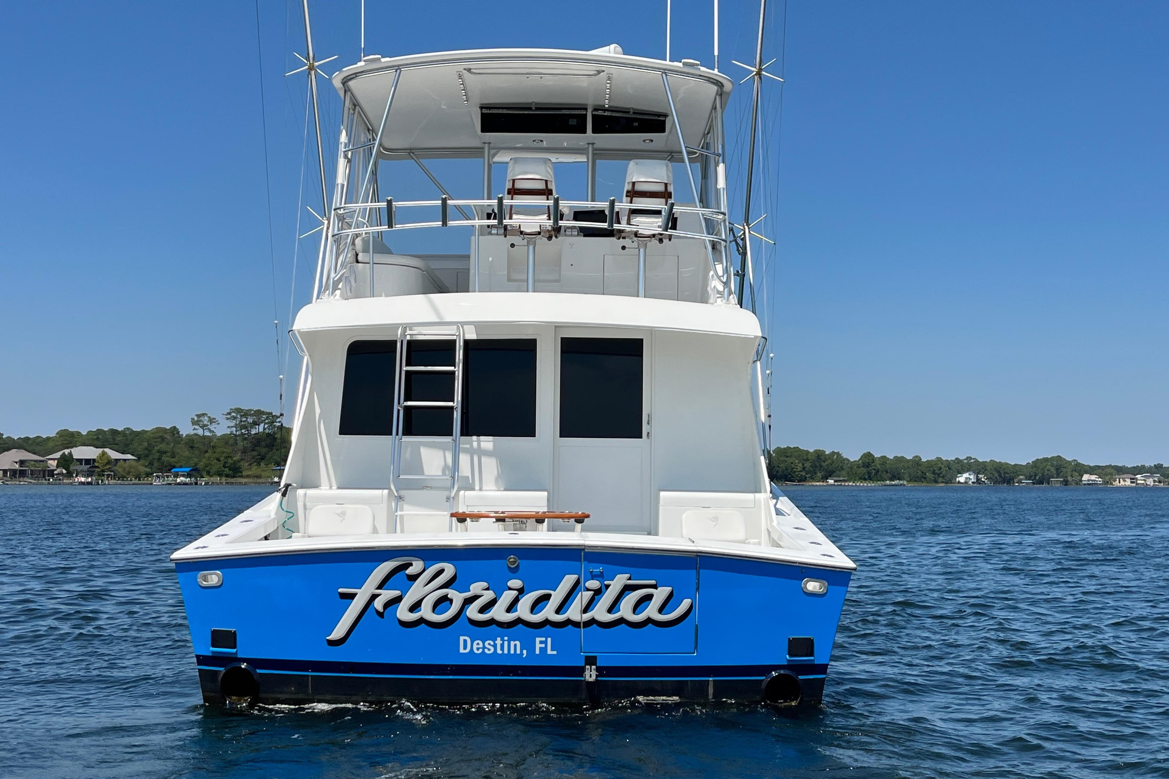 1997 Post Sportfish boat named Floridita in Destin, FL, on calm water.
