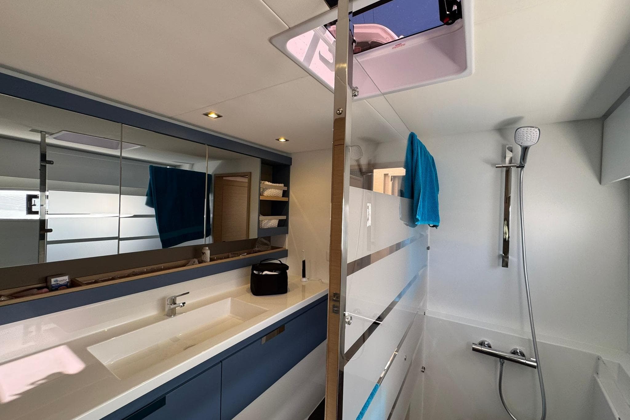 Luxurious bathroom interior of 2025 Fountaine Pajot Tanna 47 yacht with modern fixtures.