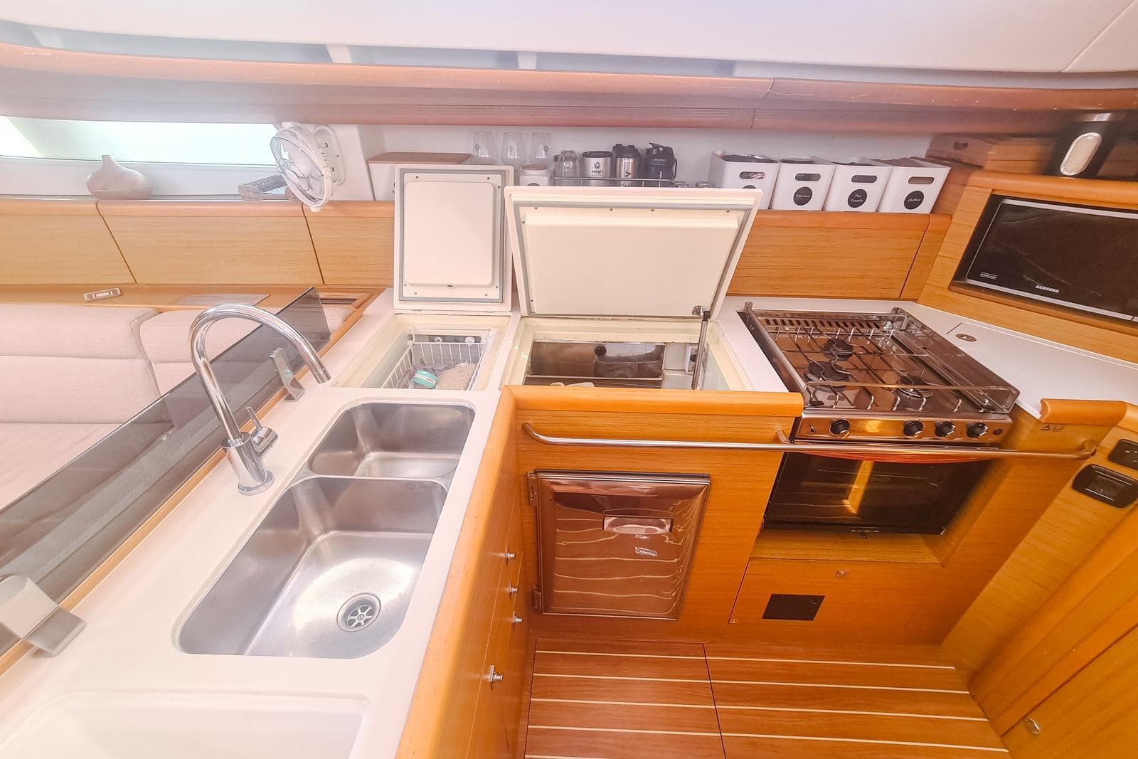 Luxurious kitchen in 2009 Jeanneau Sun Odyssey 50 DS yacht with modern amenities.