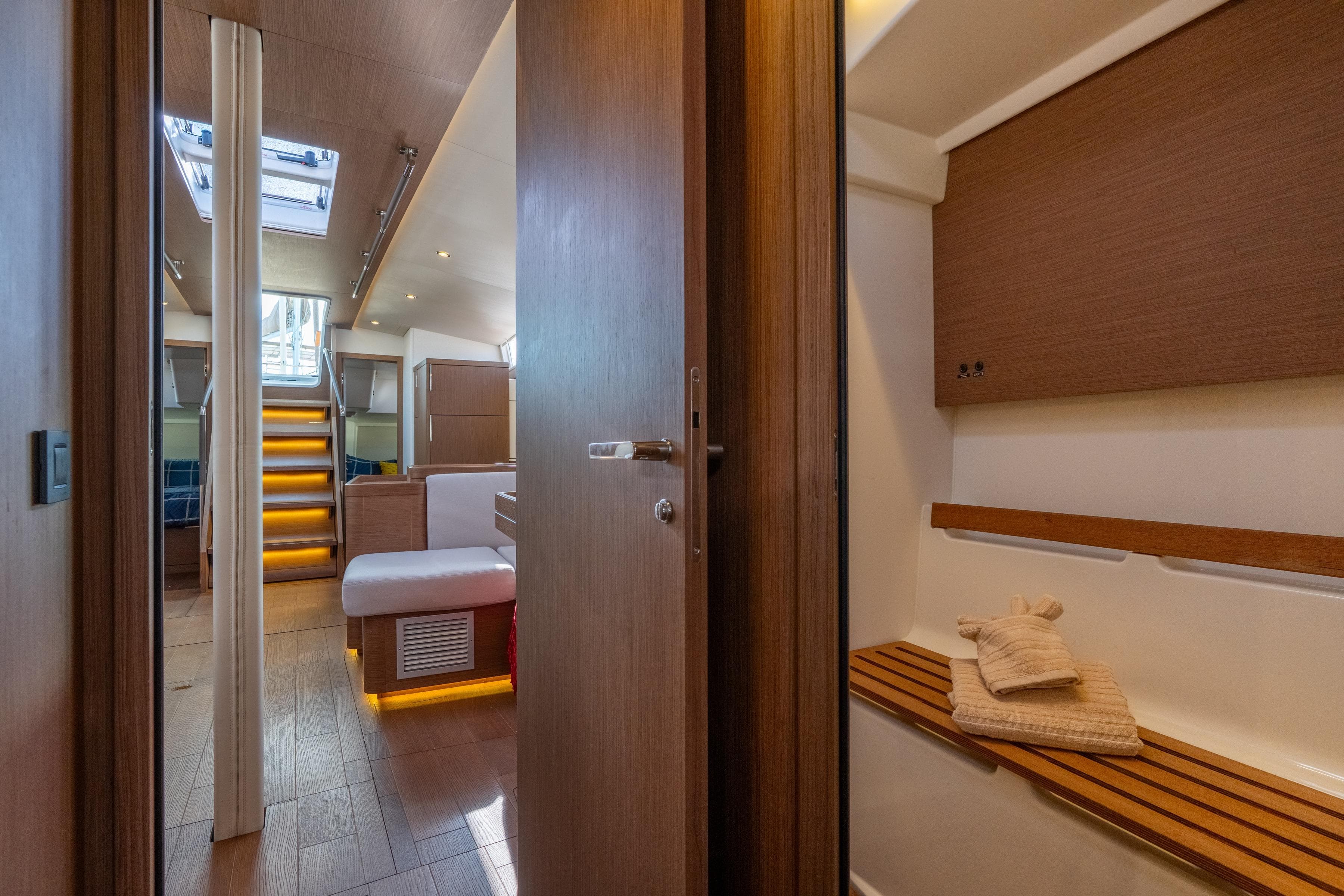 Interior of 2021 Beneteau Oceanis Yacht 54, featuring elegant wood finishes and modern design.