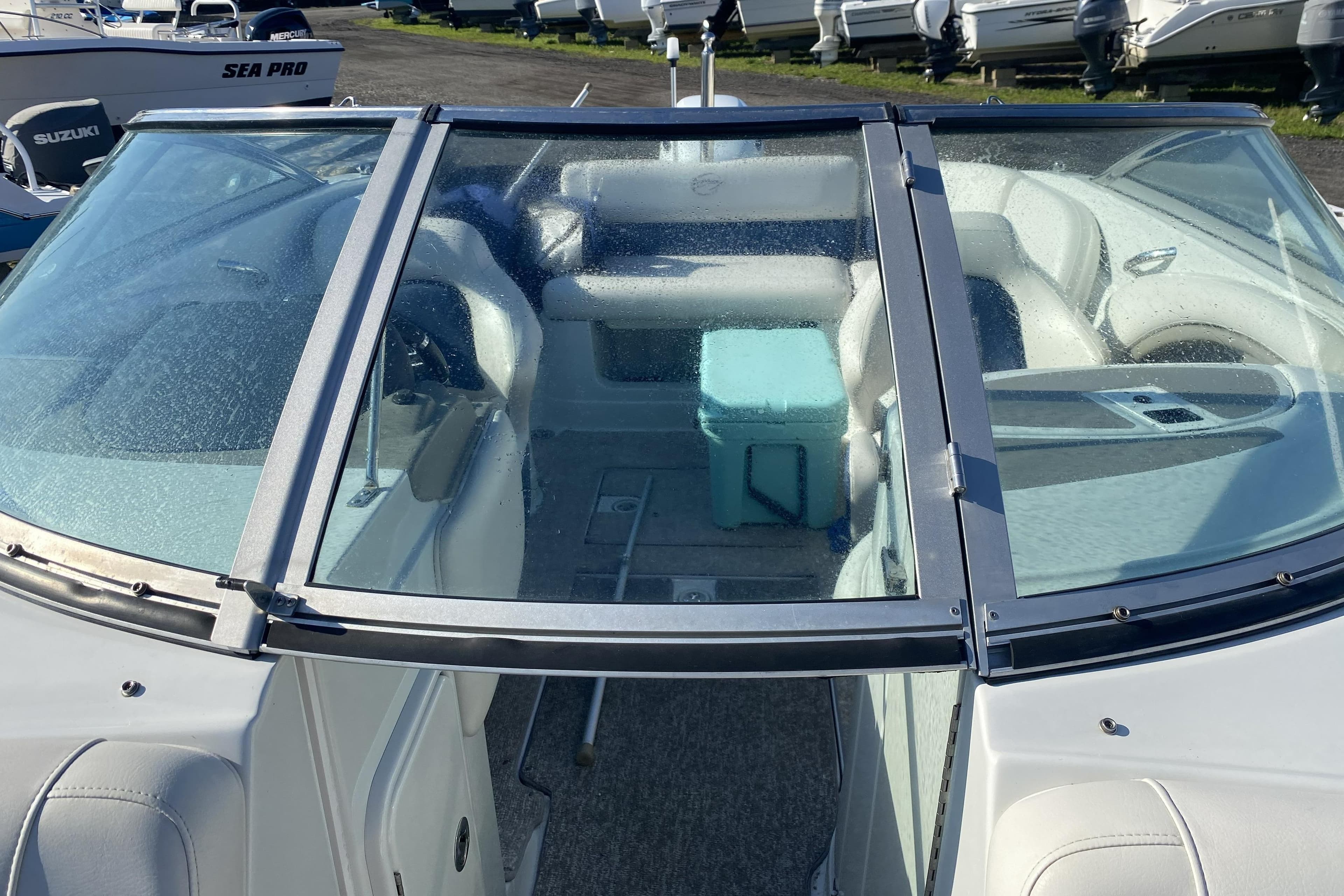 2017 Crownline Eclipse E2 XS boat interior with seating and a cooler.