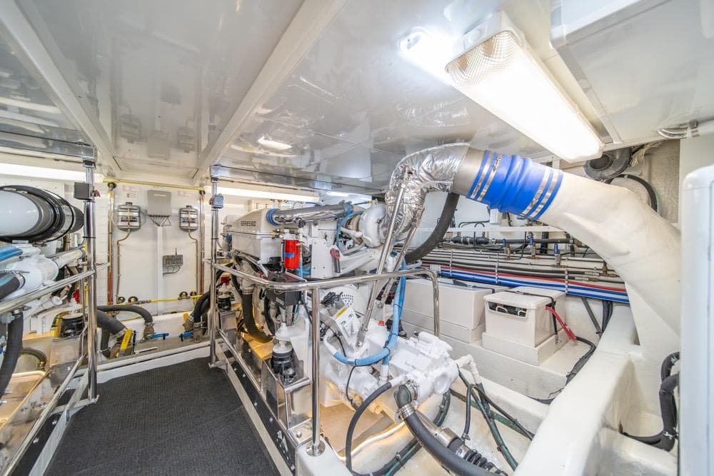 Engine room of 2005 Ocean Alexander 64 Motoryacht, showcasing mechanical systems and equipment.