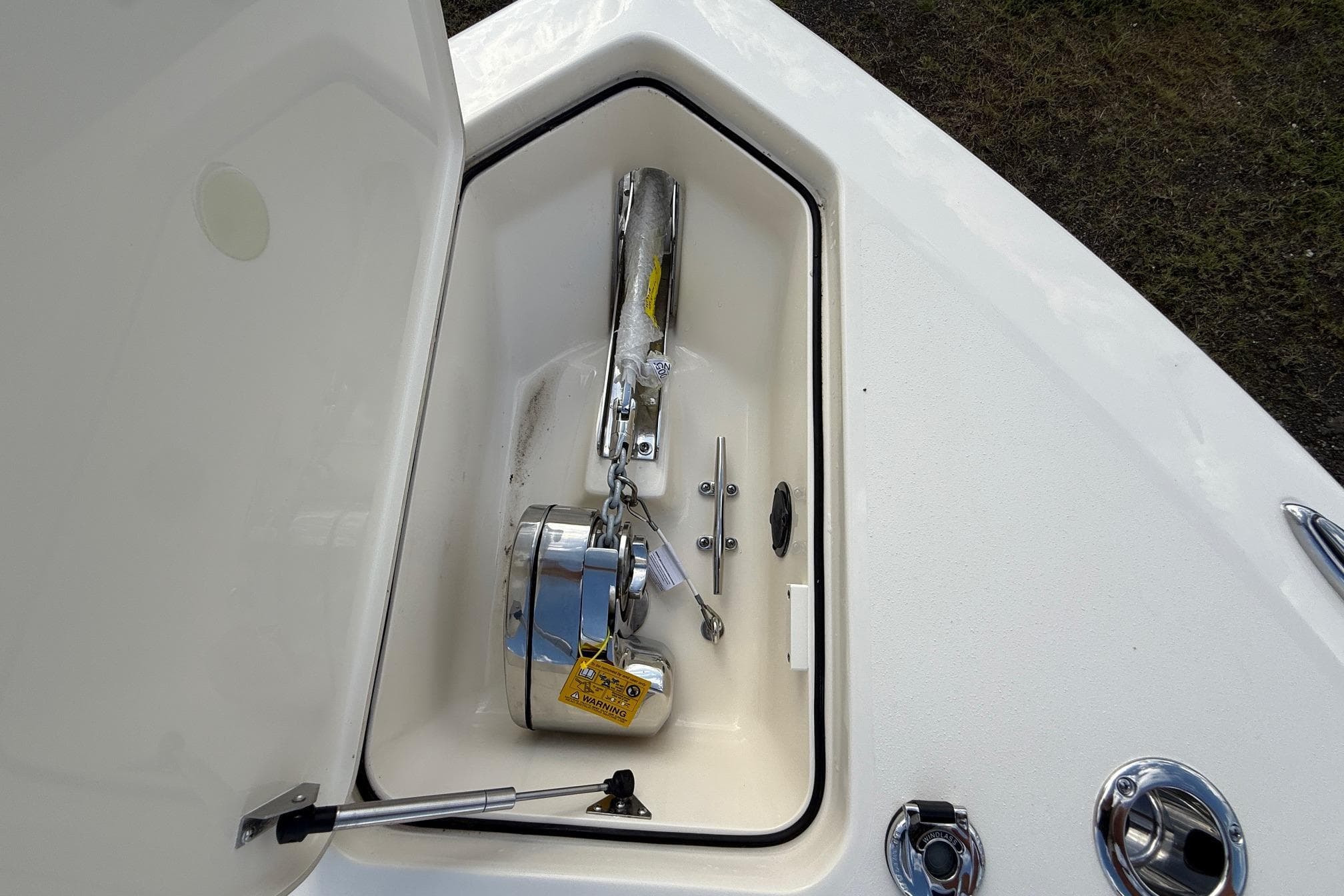 Anchor compartment of 2026 Scout 260 LXF boat, featuring a neatly stored anchor and chain.