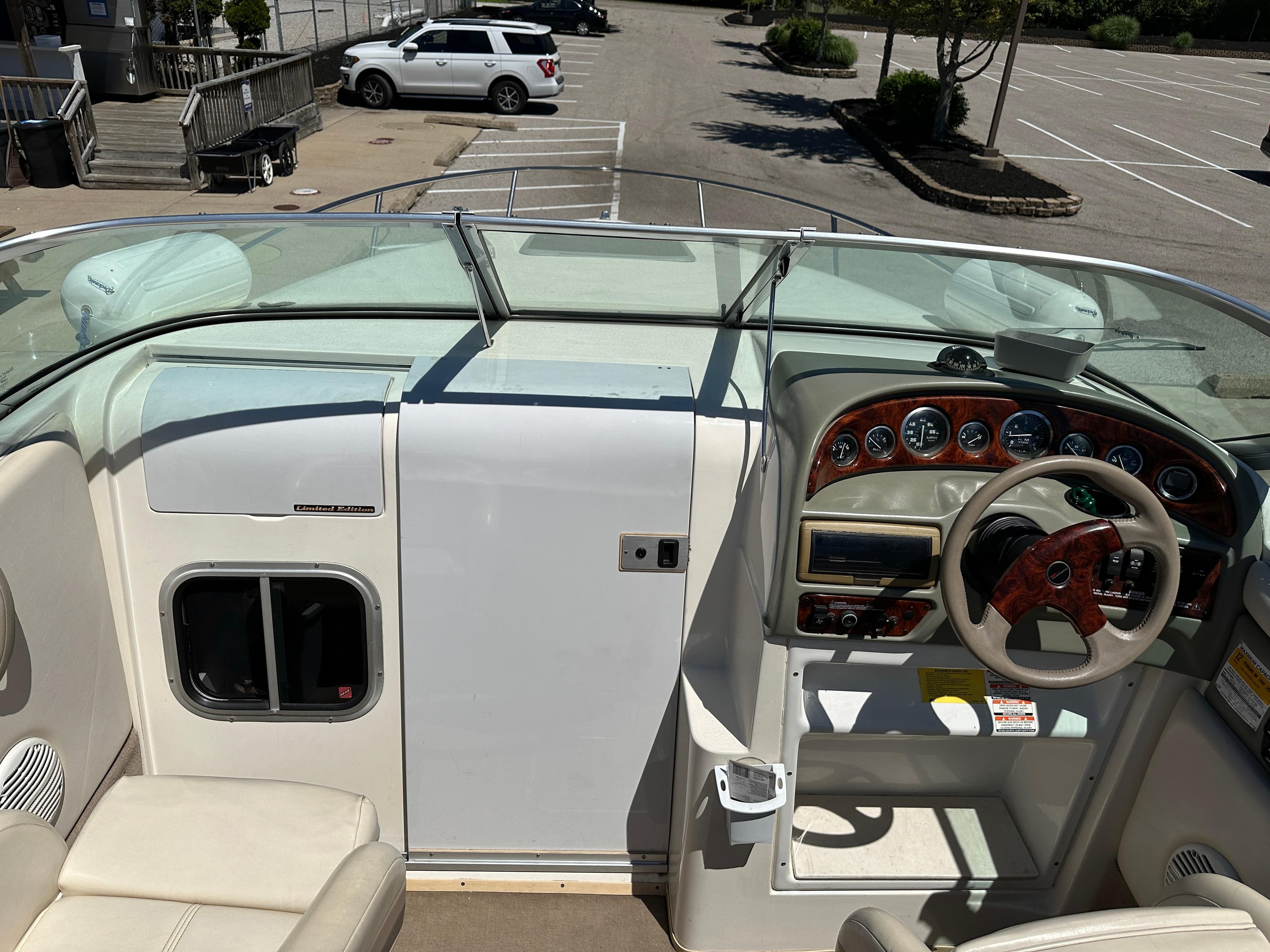 1998 Chaparral 2335 SS boat interior with steering wheel and dashboard.