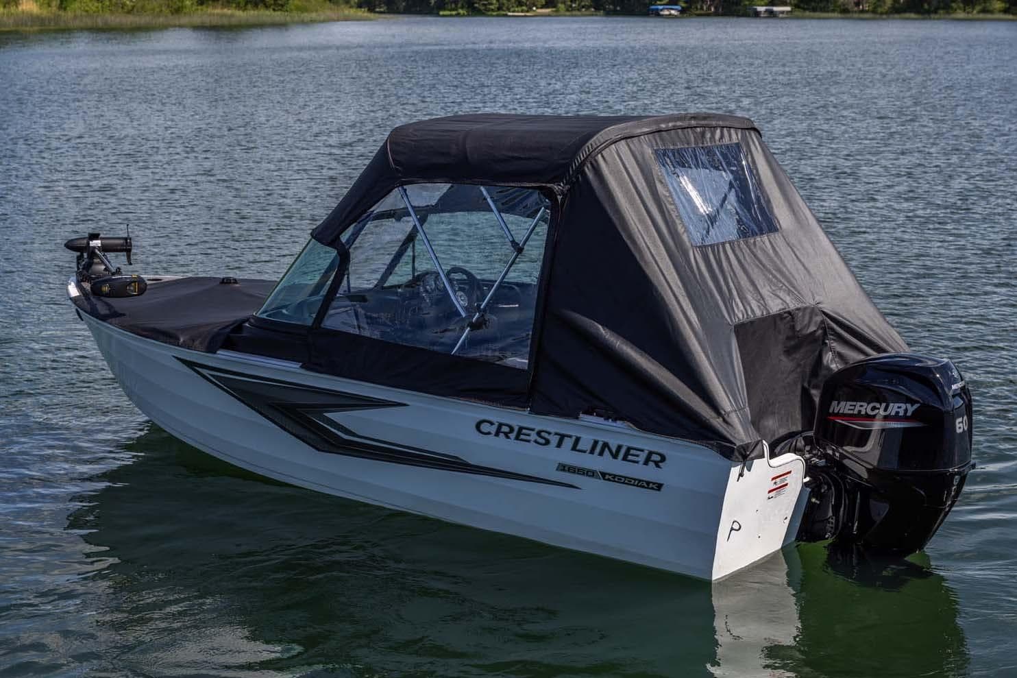 Manufacturer Provided Image: 2026 Crestliner 1650 Kodiak WT boat on calm lake with Mercury outboard motor.