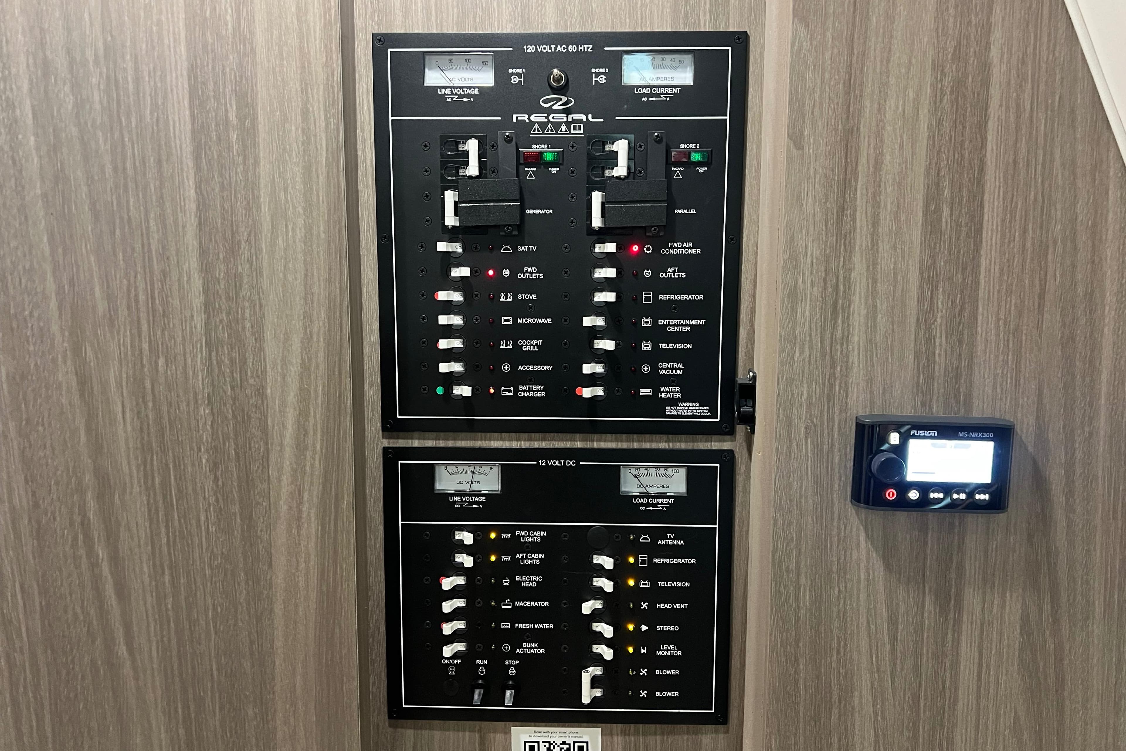 Electrical control panel of a 2019 Regal 33 Express boat, featuring switches and indicators.