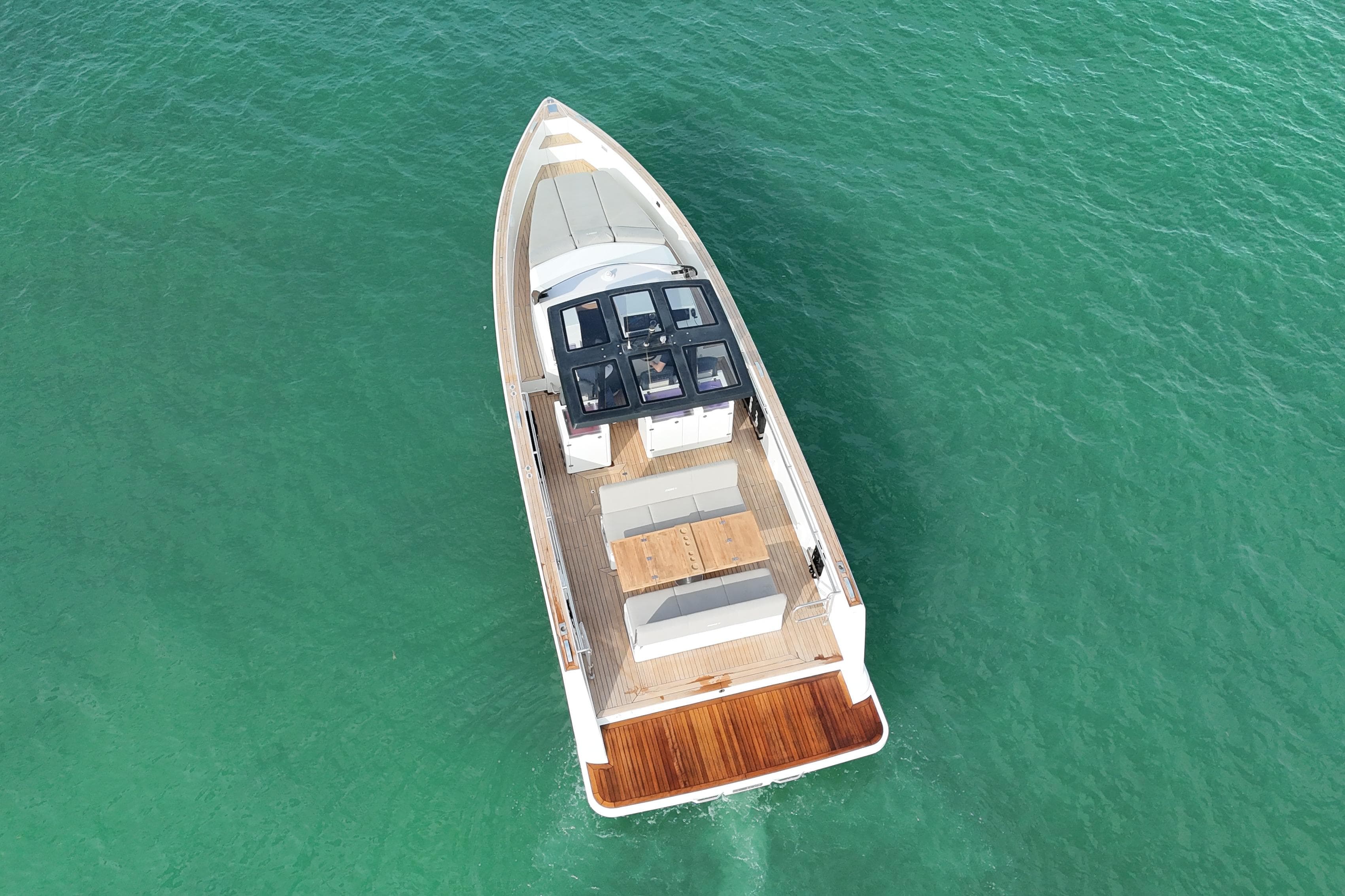 Aerial view of 2019 Fjord 40' Open yacht on turquoise water.