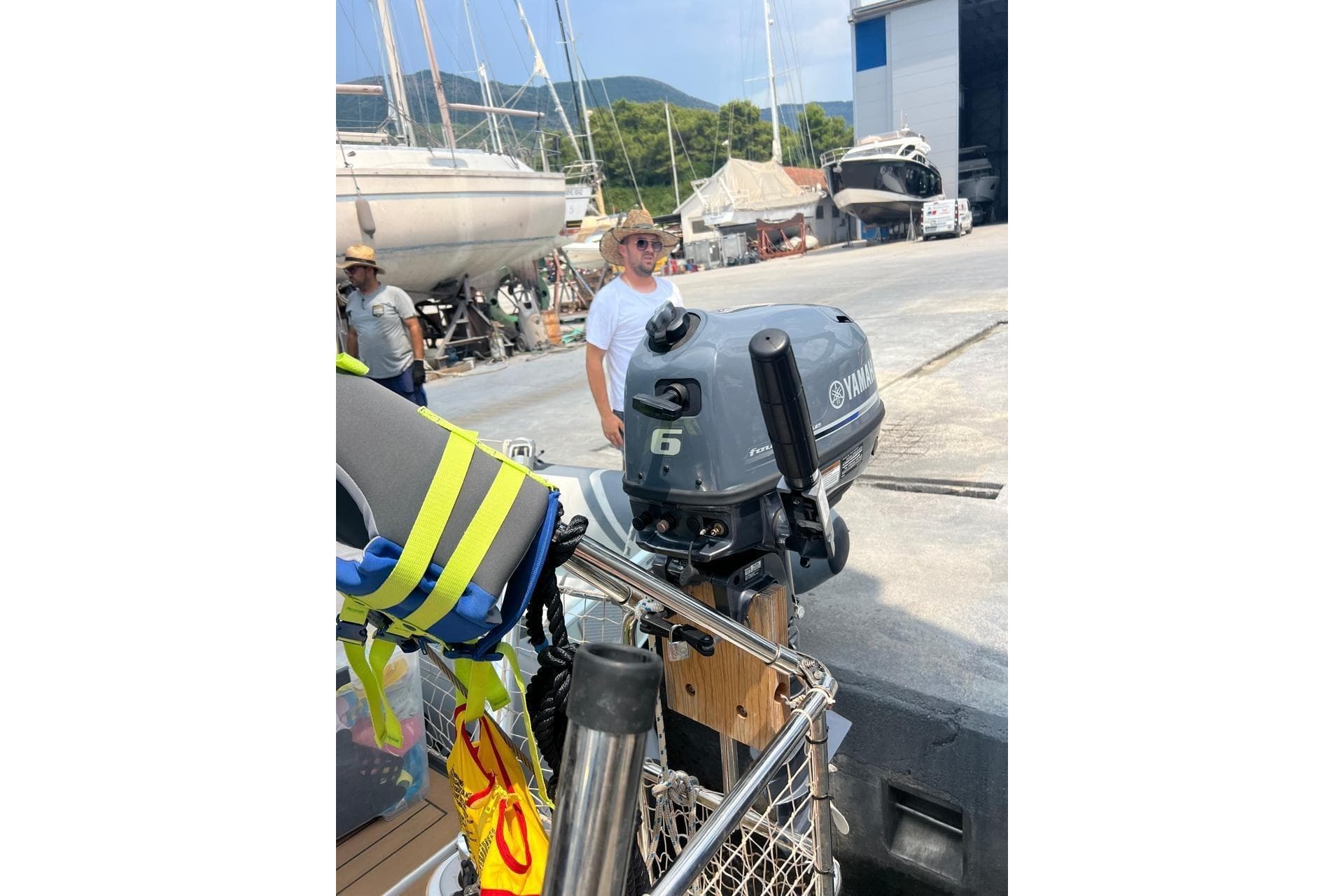 Yamaha outboard motor on a 2023 Hanse 460 yacht at a marina.