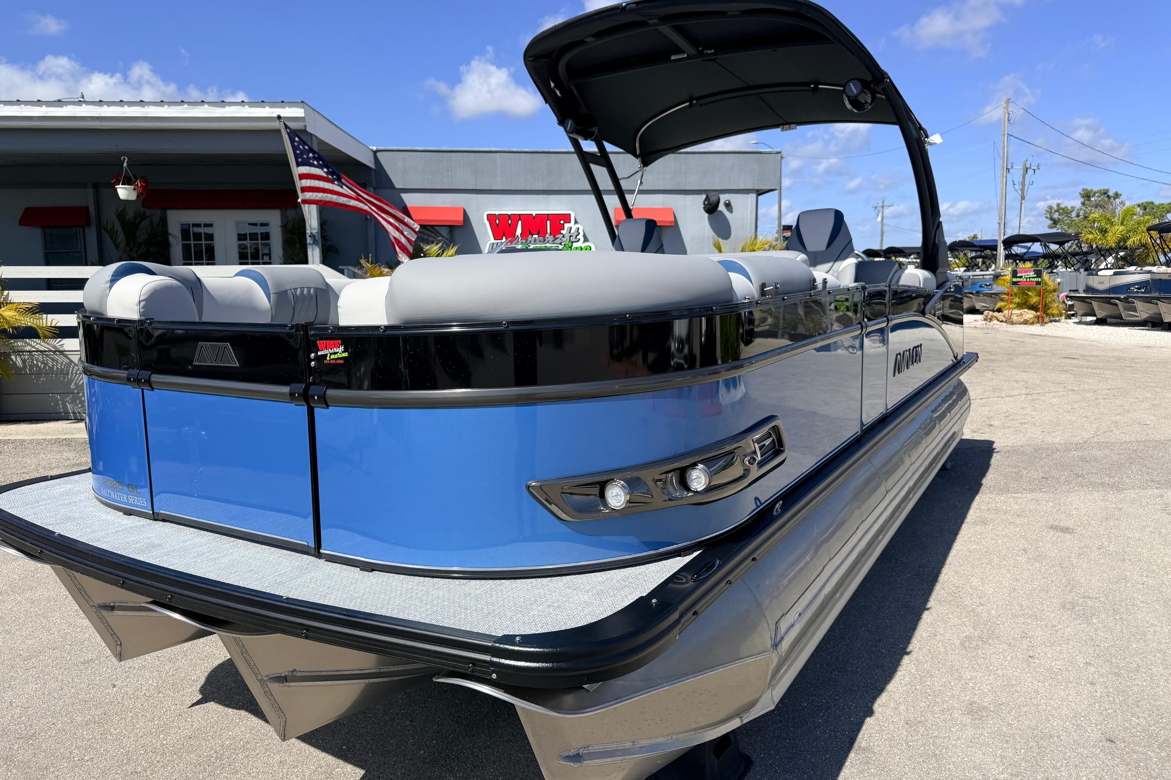2026 Avalon 2385 Catalina Quad Lounger, Tri Toon High Performance boat in a dealership lot.