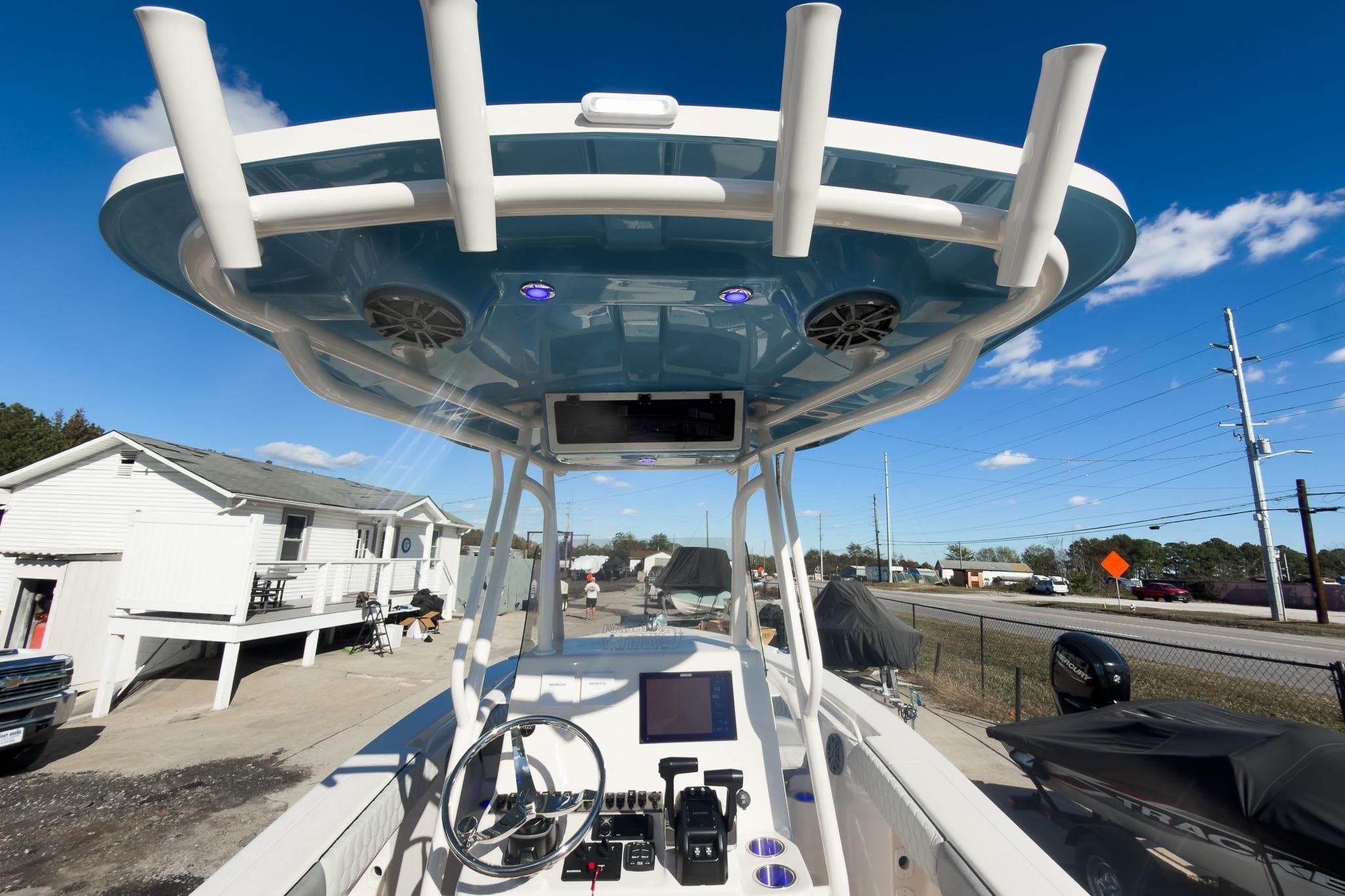 2026 Sea Chaser 24 HFC DE boat console with advanced controls and overhead speakers.