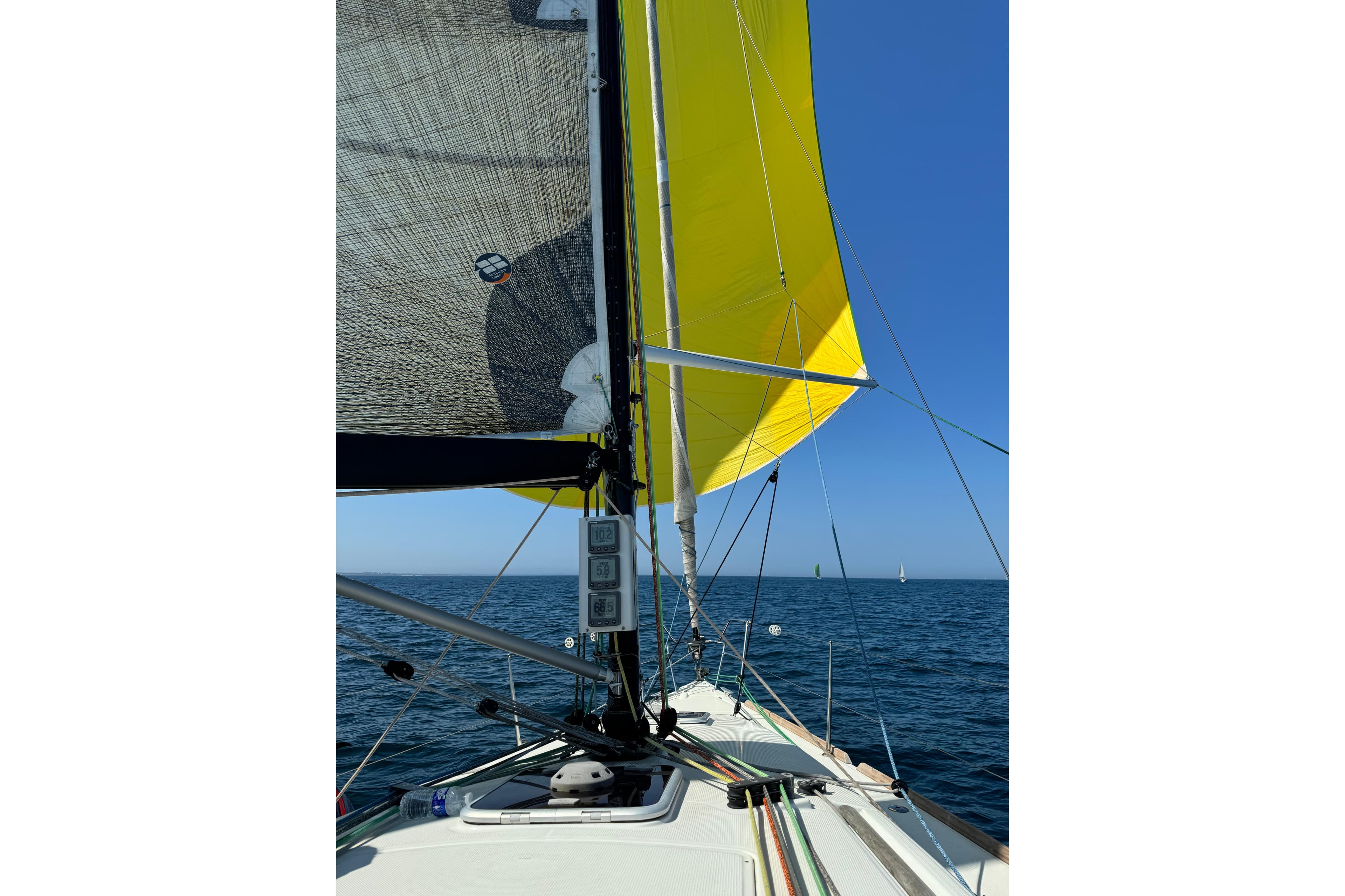 Sailing on a 2011 Beneteau First 35 with vibrant yellow sails on open water.