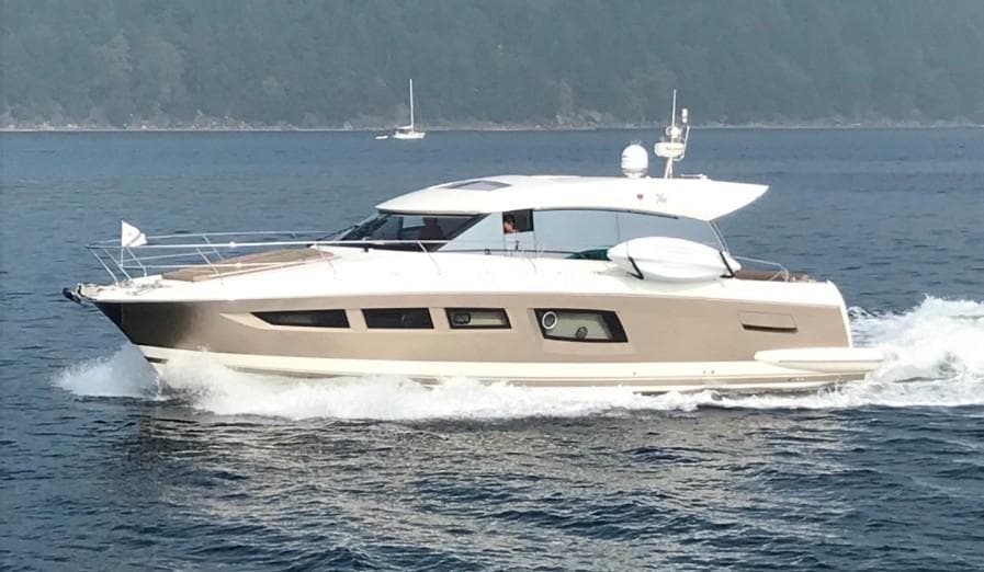 2016 Prestige 500 S yacht cruising on open water.