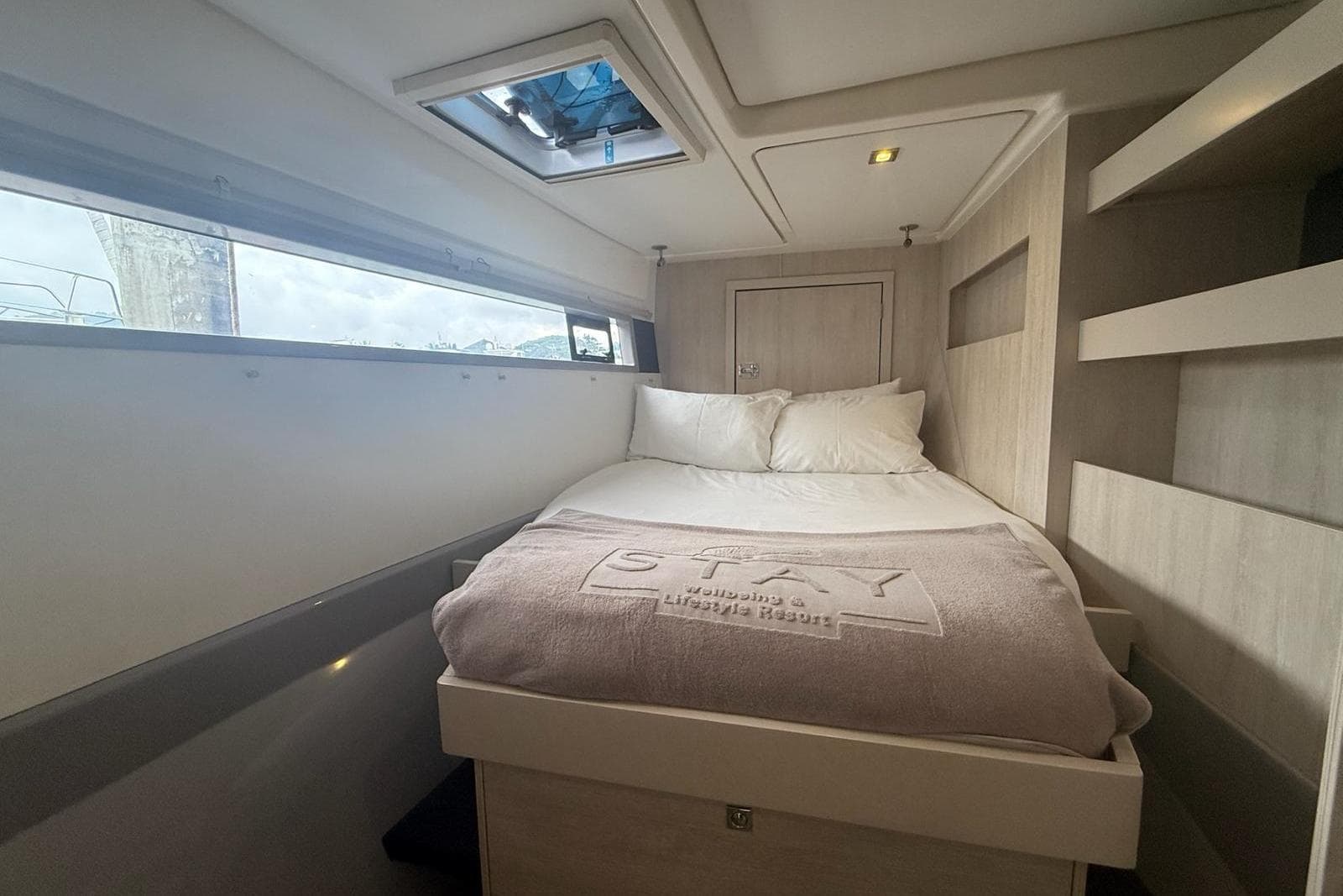 Luxurious cabin interior of 2019 Leopard 51 Powercat with cozy bed and modern design.