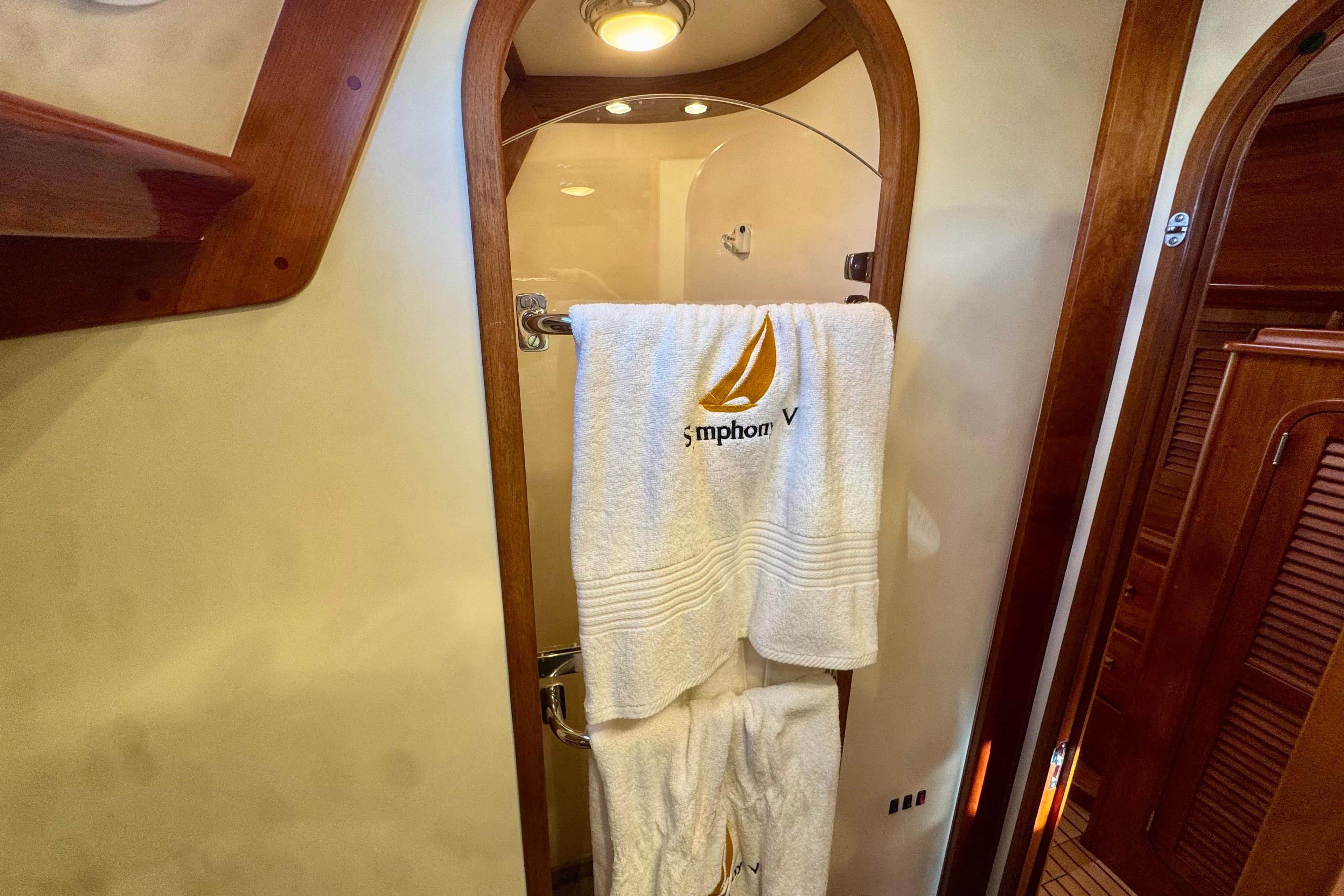 Luxury bathroom interior of 1999 Hinckley Sou'wester 52 yacht with embroidered towels.