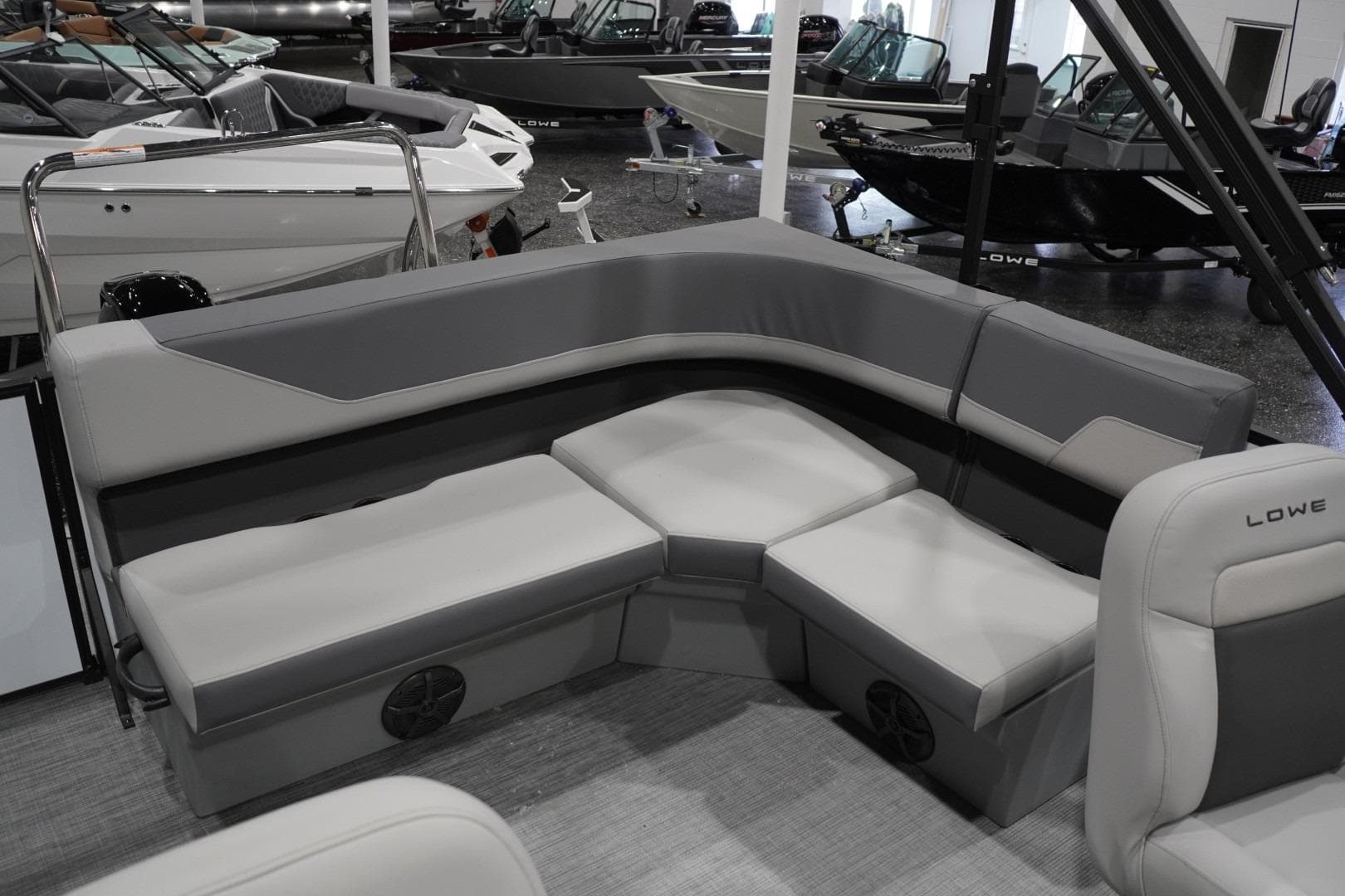 2026 Lowe LS 190 boat interior with gray seating in showroom.
