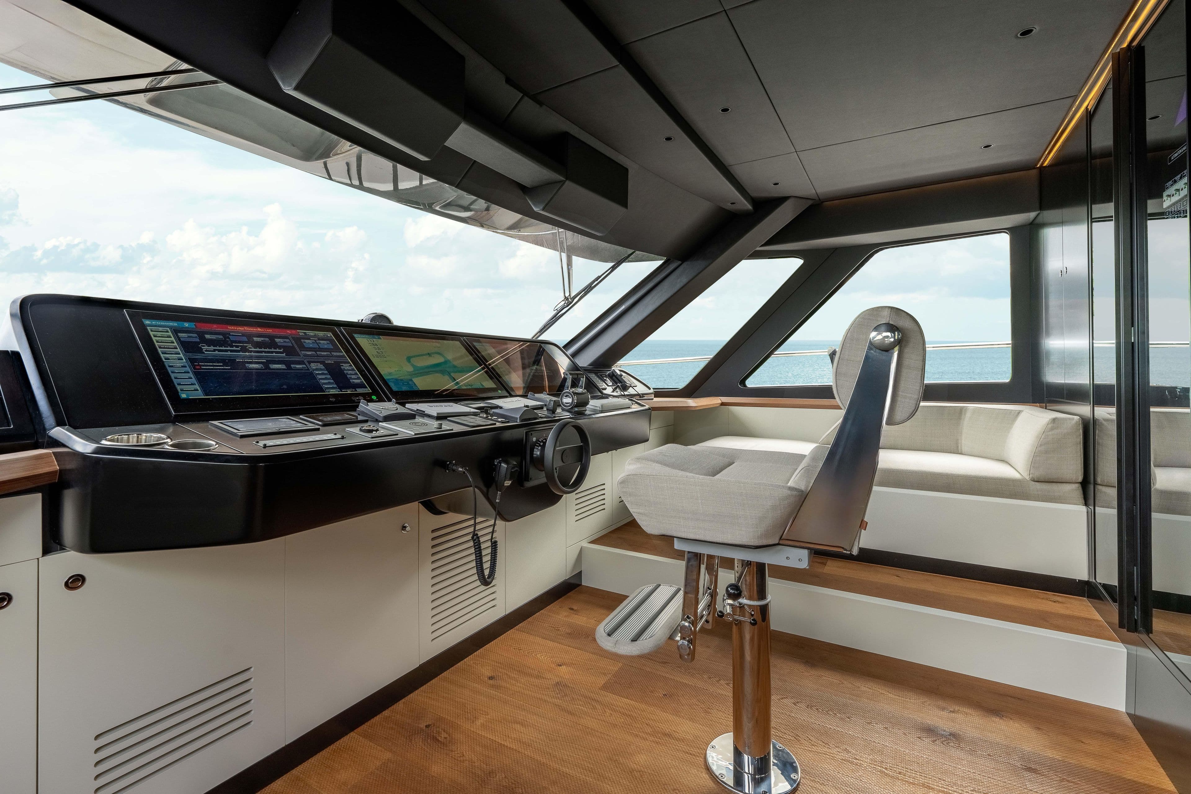 Luxurious 2025 Alpha Squalo Co Ownership yacht interior with modern helm and panoramic windows.