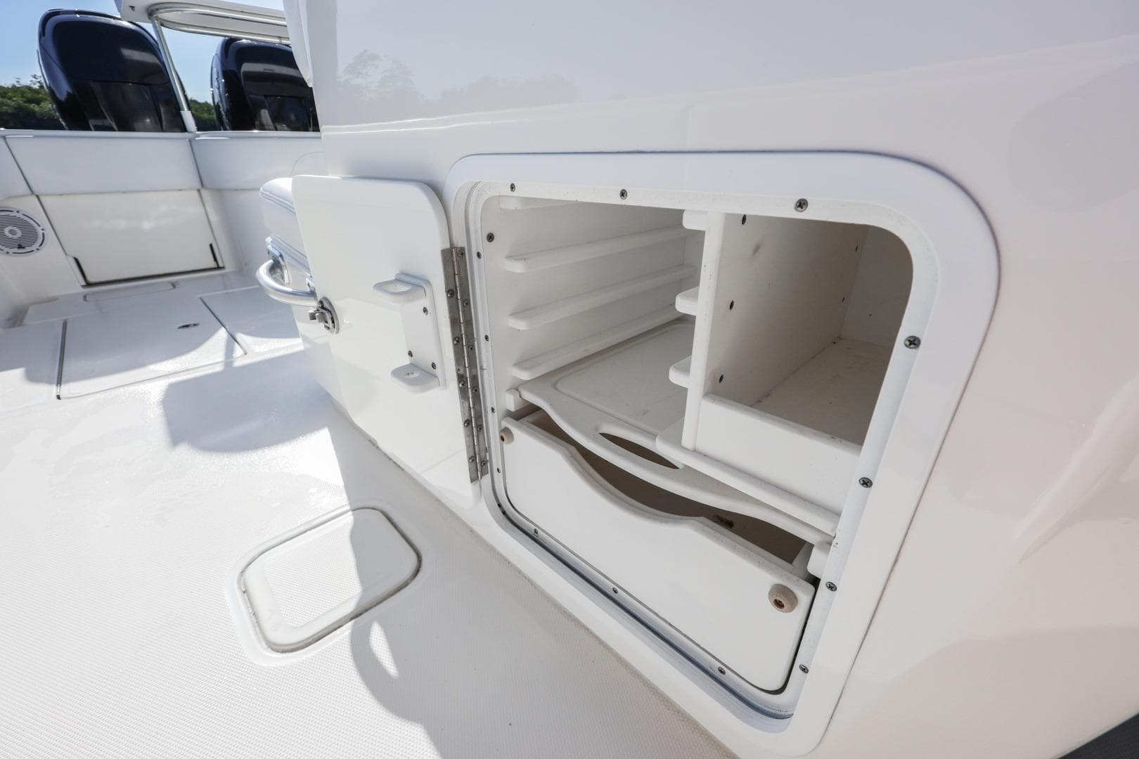 Open storage compartment on 2016 Invincible 39 Open Fisherman boat deck.