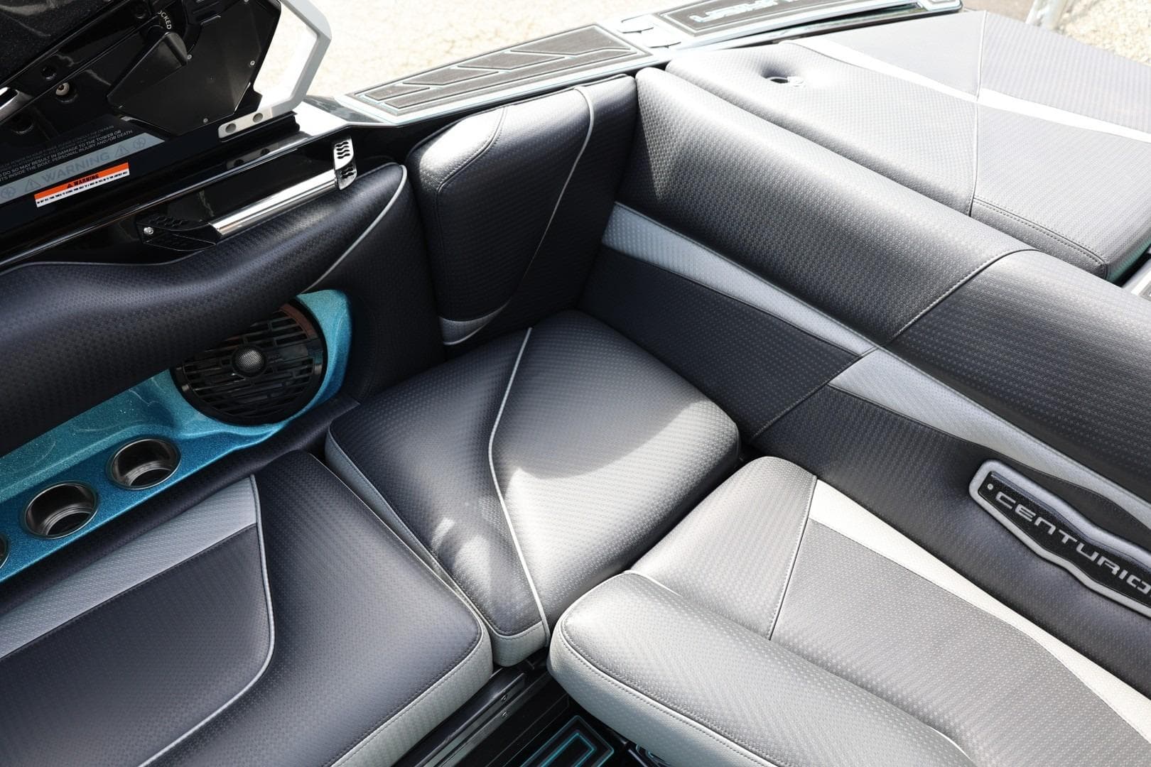 2021 Centurion Fi23 boat interior with sleek gray seating and speaker system.