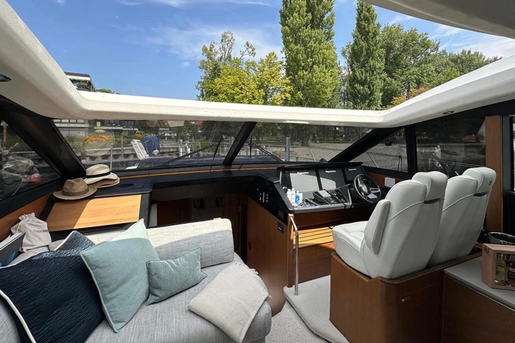 Luxurious 2017 Princess S60 yacht interior with plush seating and modern helm.