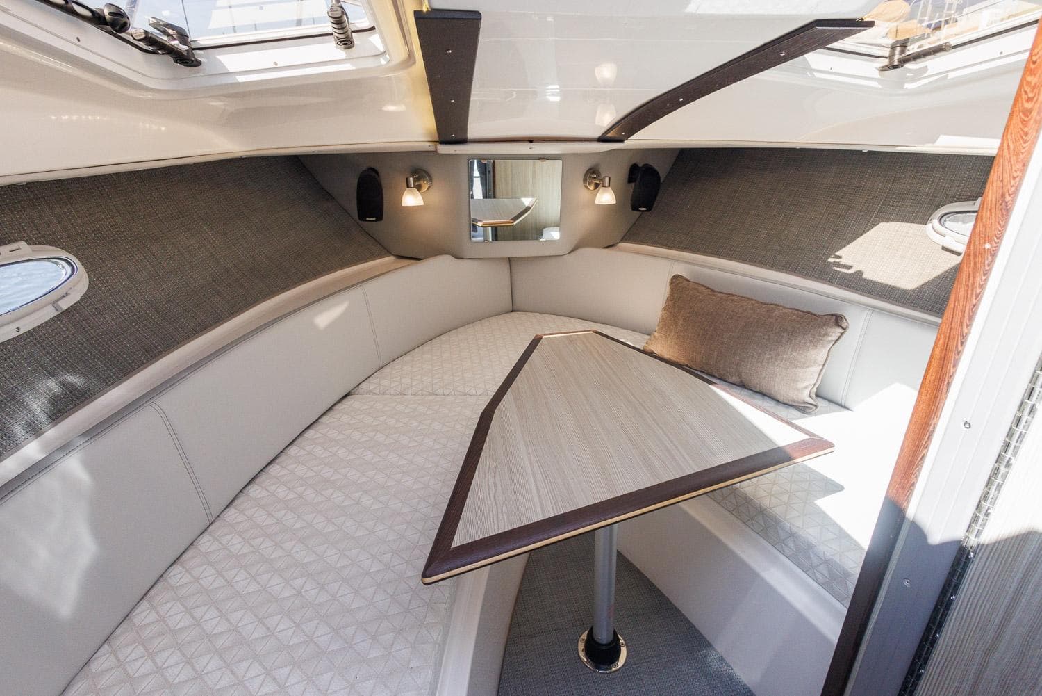 Luxurious interior of 2025 Solara S-250 Coupe with elegant seating and table.