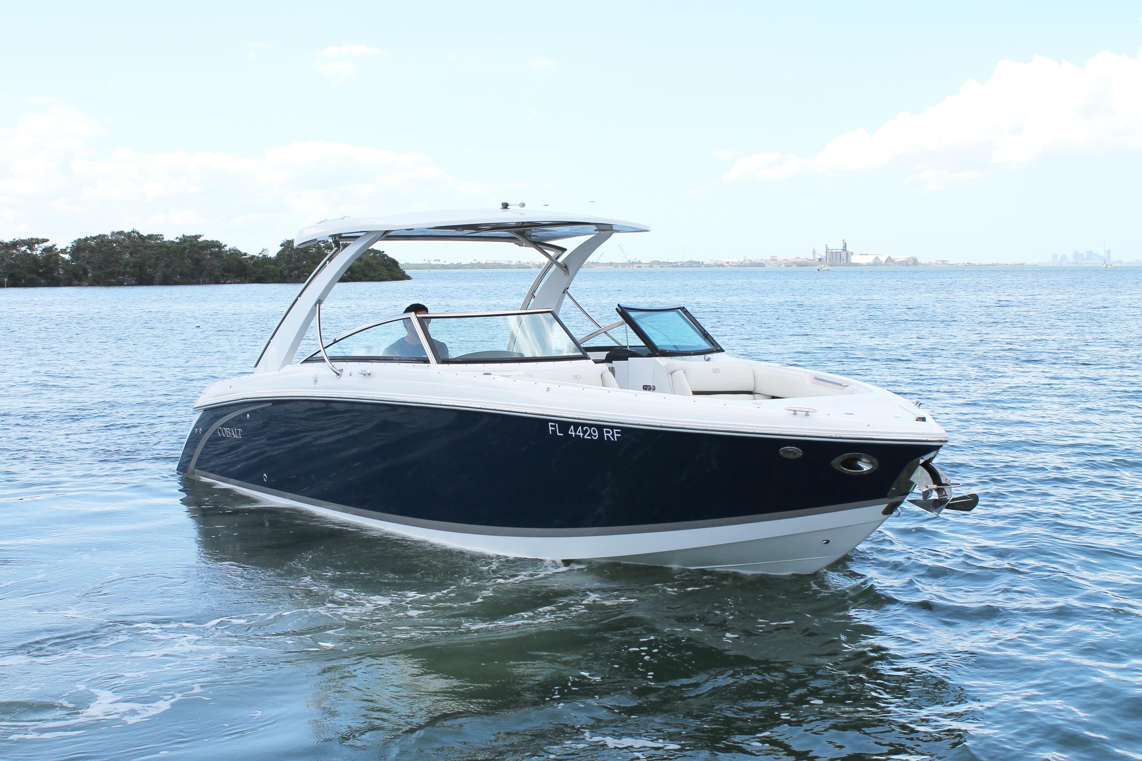 2017 Cobalt R30 boat cruising on open water under a clear sky.