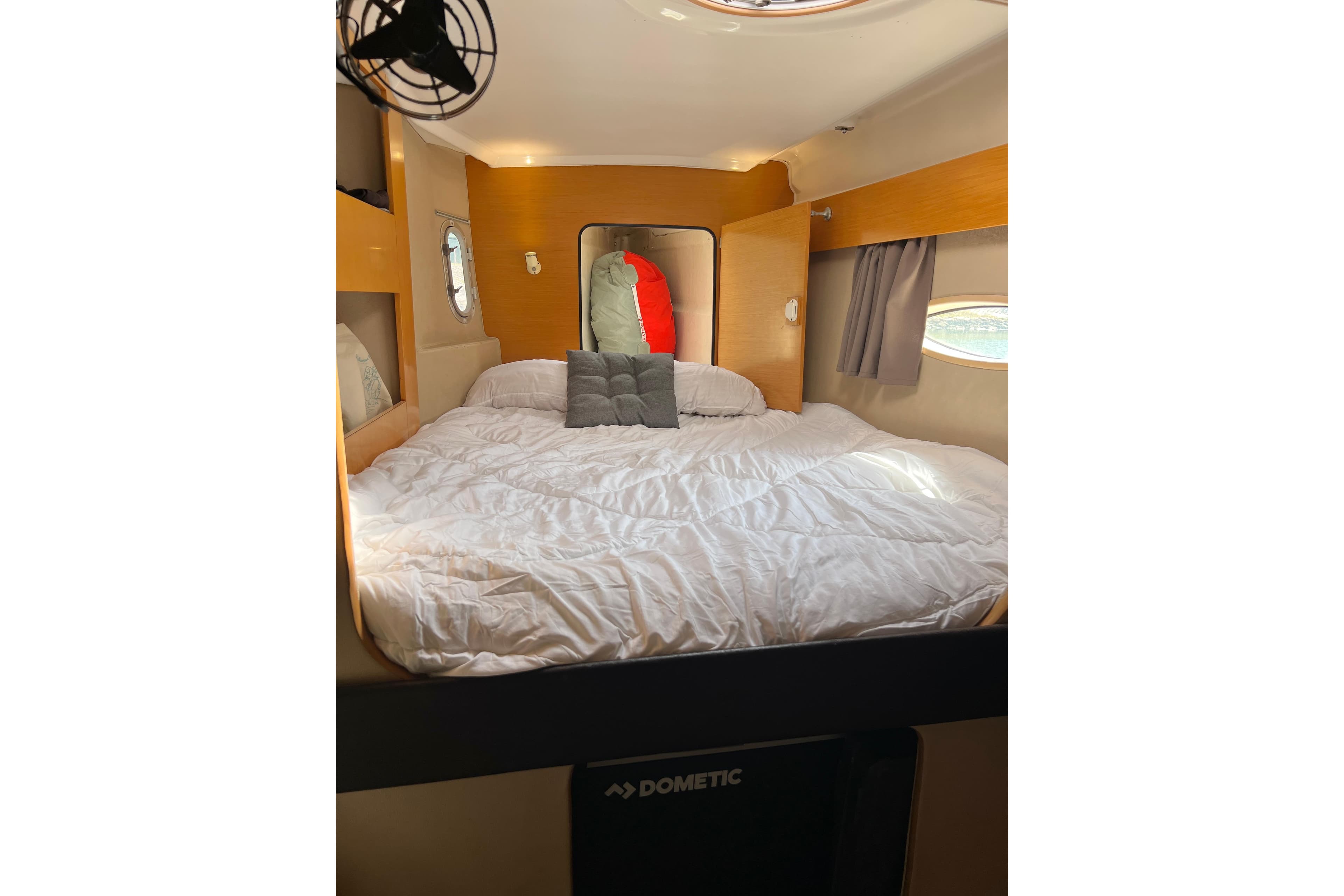 Cozy cabin interior of 2009 Fountaine Pajot Lipari 41 catamaran with comfortable bedding.