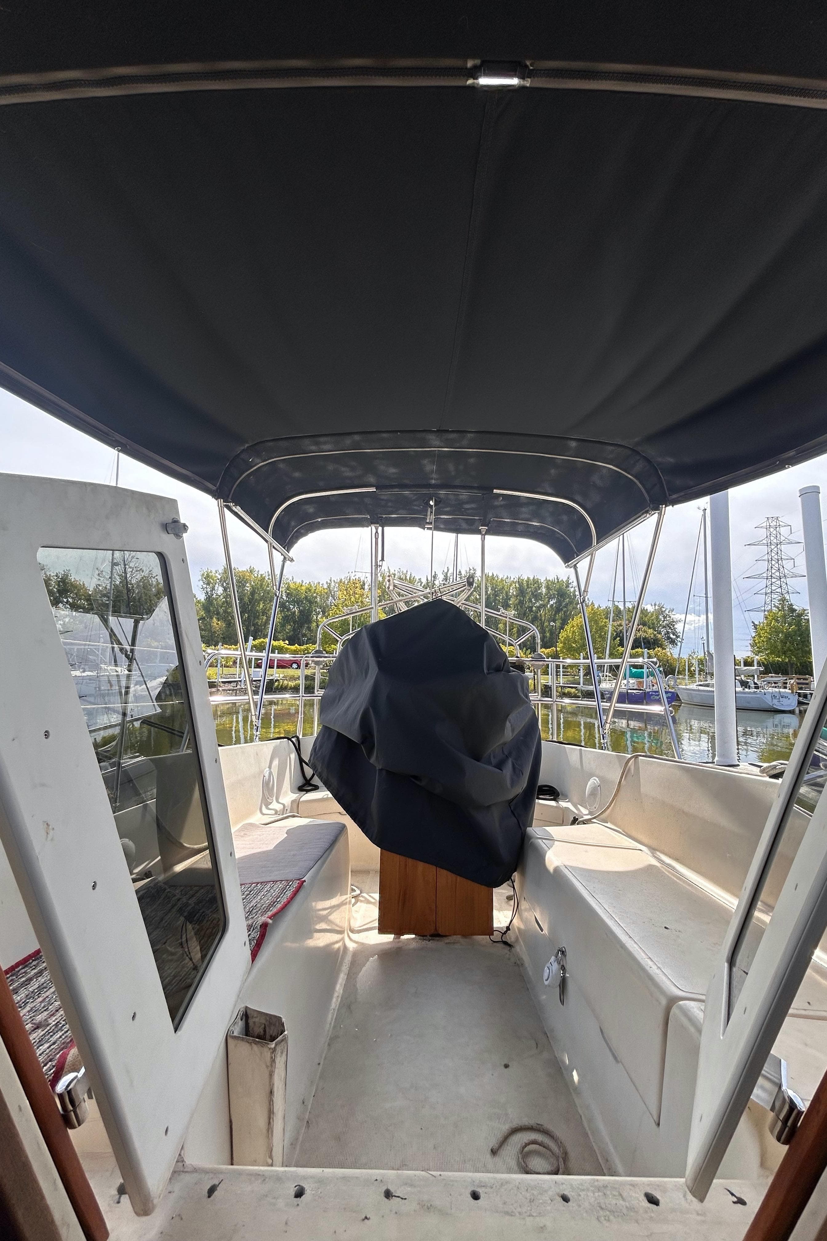 1982 S2 11.0 A sailboat interior with covered helm and canopy.