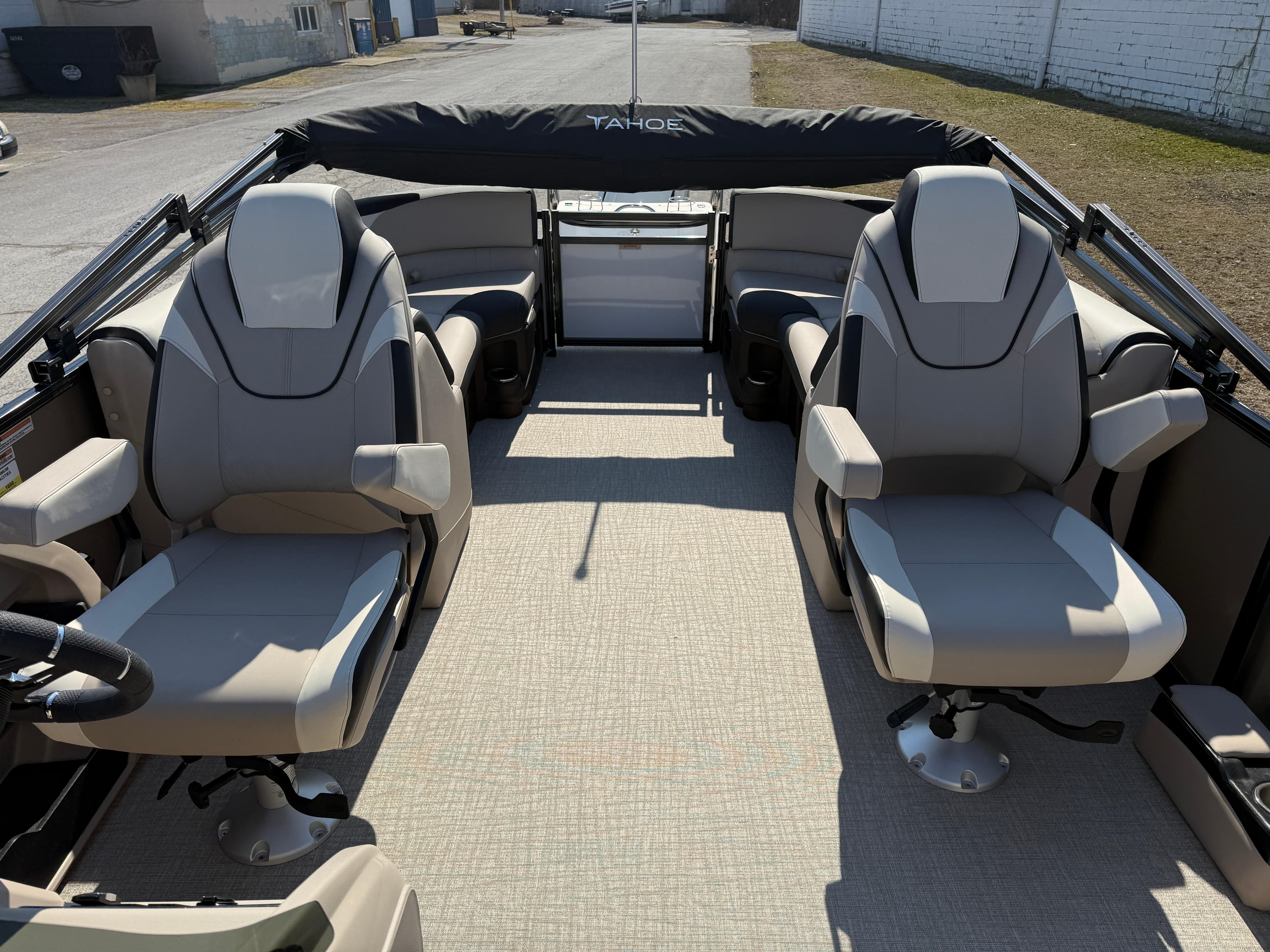 2025 Tahoe Pontoon LTZ Quad Lounger interior with plush seating and modern design.