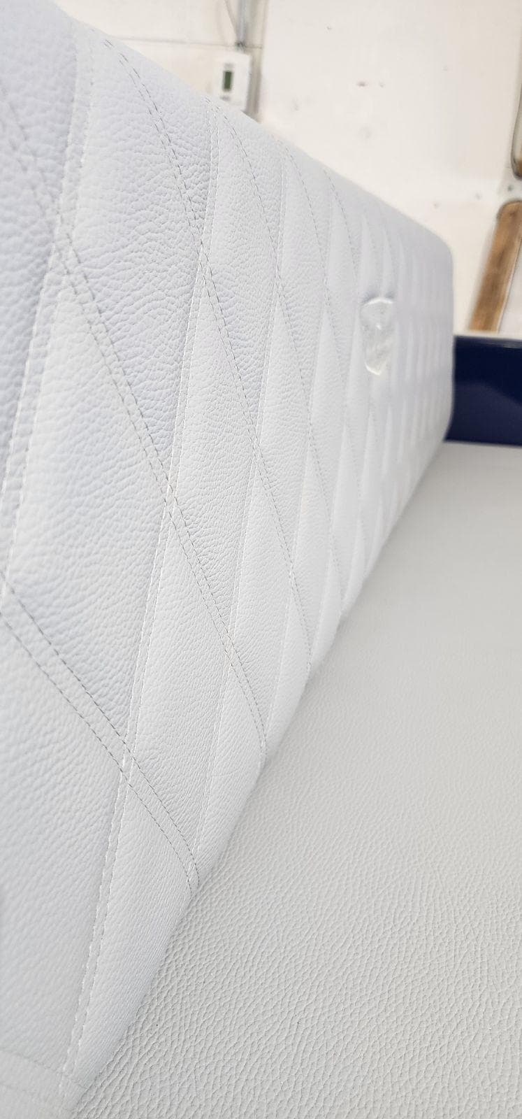 Quilted white leather seat detail in 2023 Vision Marine Technologies Volt 180.