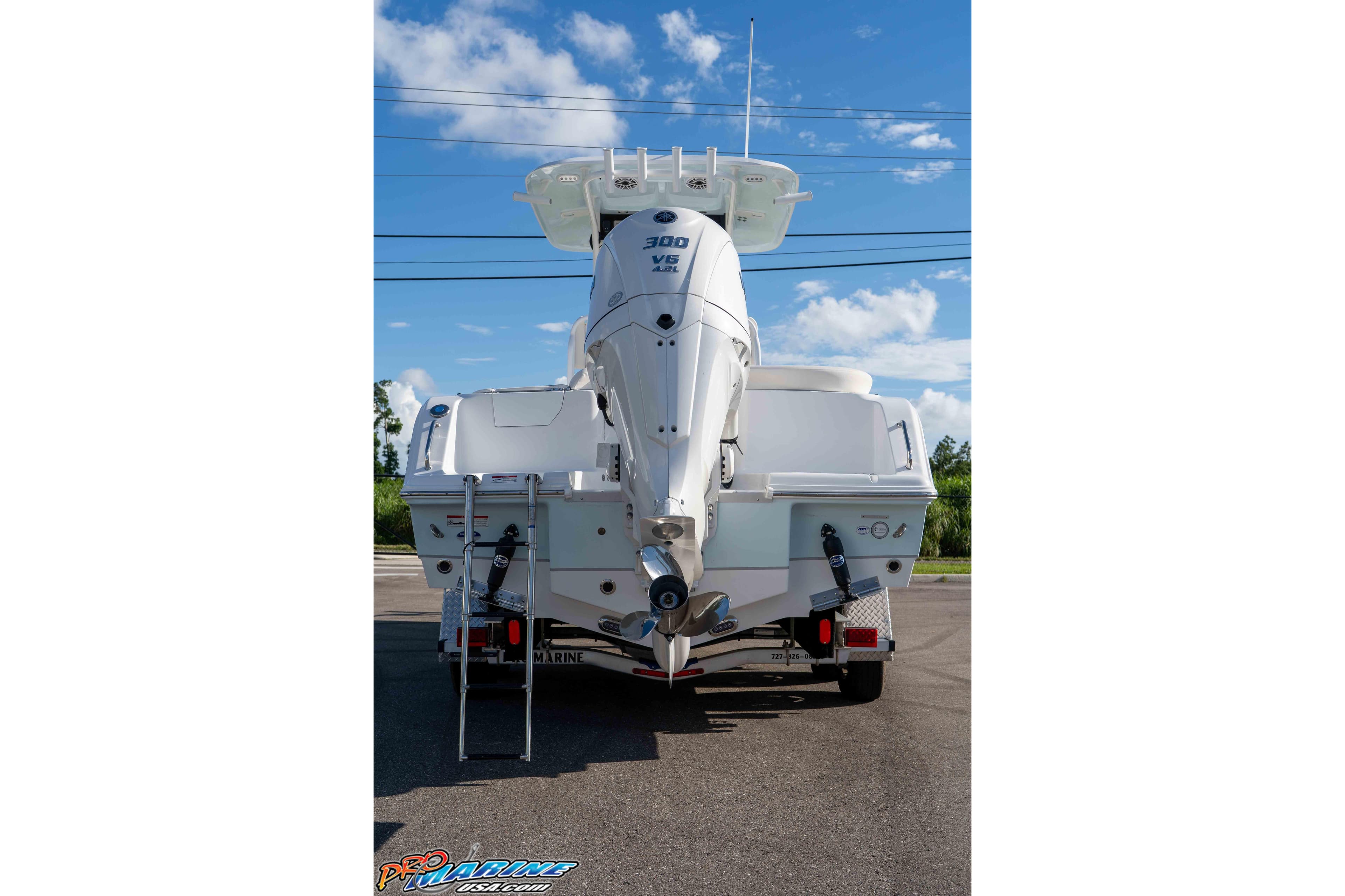 2025 Sea Hunt Ultra 245 SE boat with powerful 300 V6 engine, rear view.