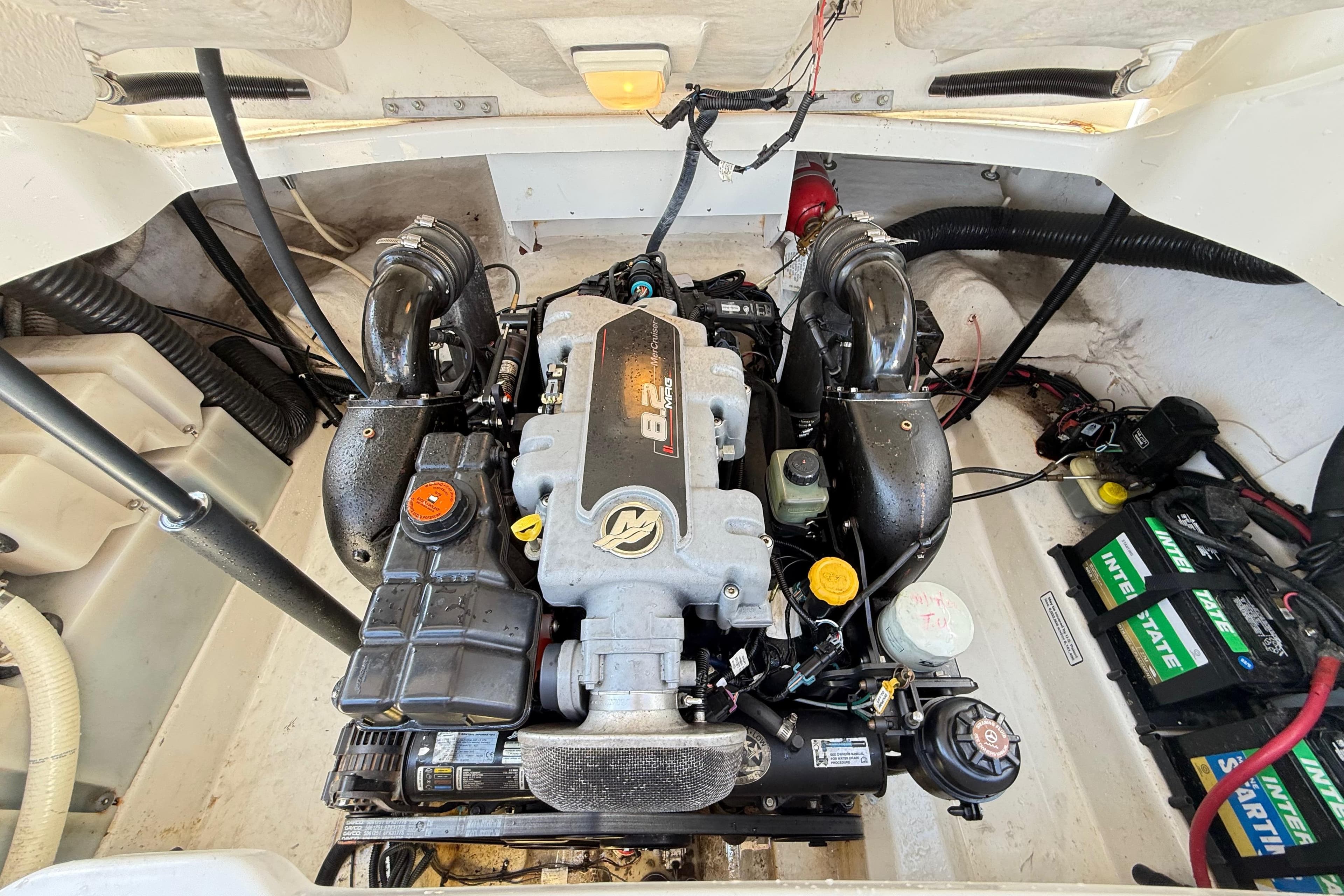 Engine compartment of a 2011 Sea Ray 270 SLX boat, featuring a powerful 8.2 engine.