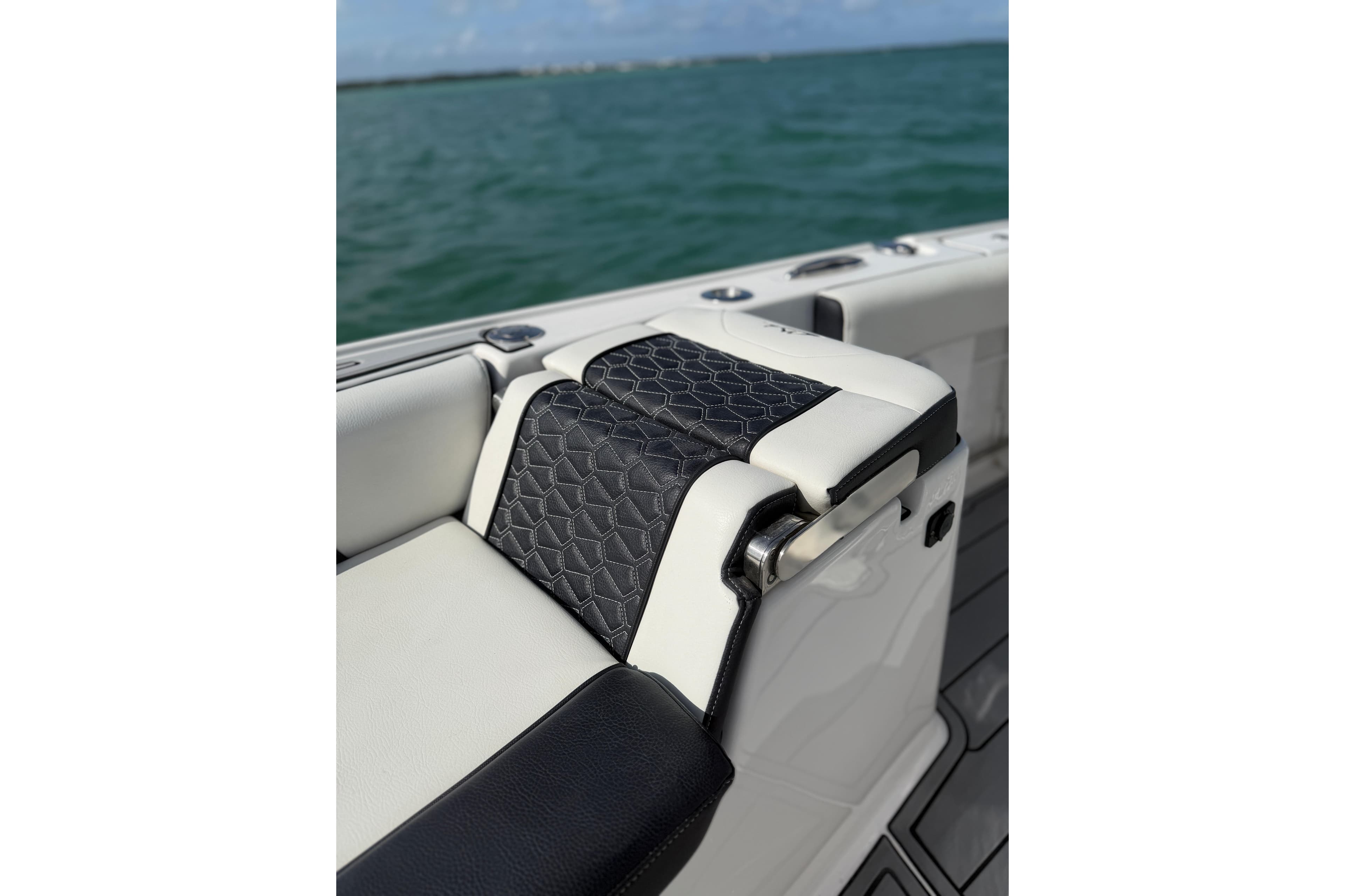 2024 Tidewater 3100 Carolina Bay boat seat detail with black and white upholstery.