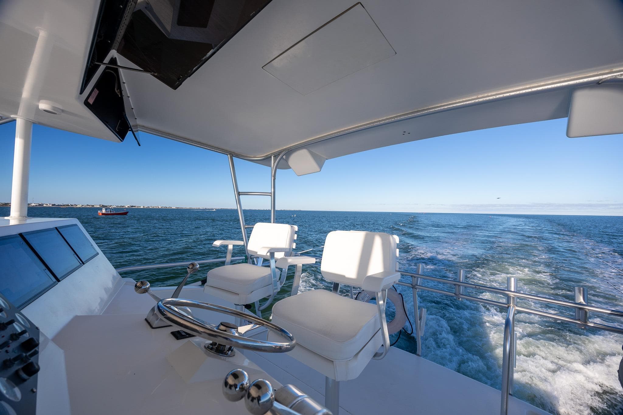 Cockpit view of 1998 Viking 50 Convertible yacht cruising on open water.