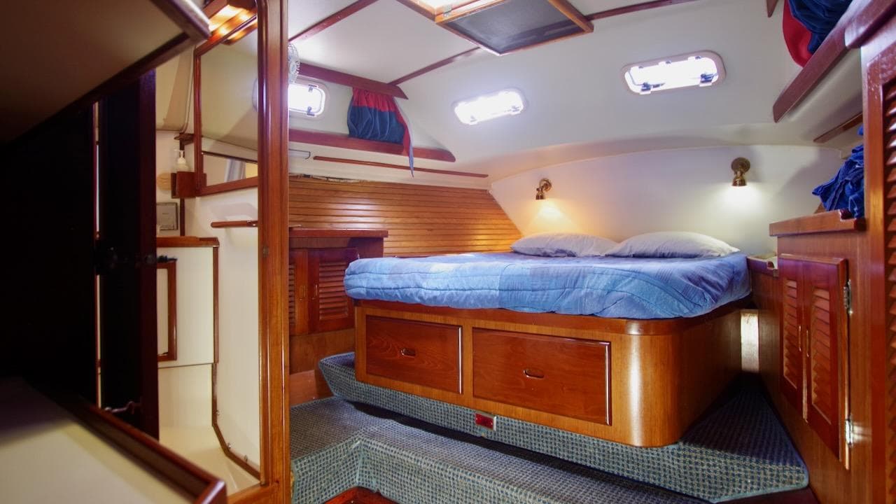 1989 Morgan 44 CC yacht cabin interior with bed.