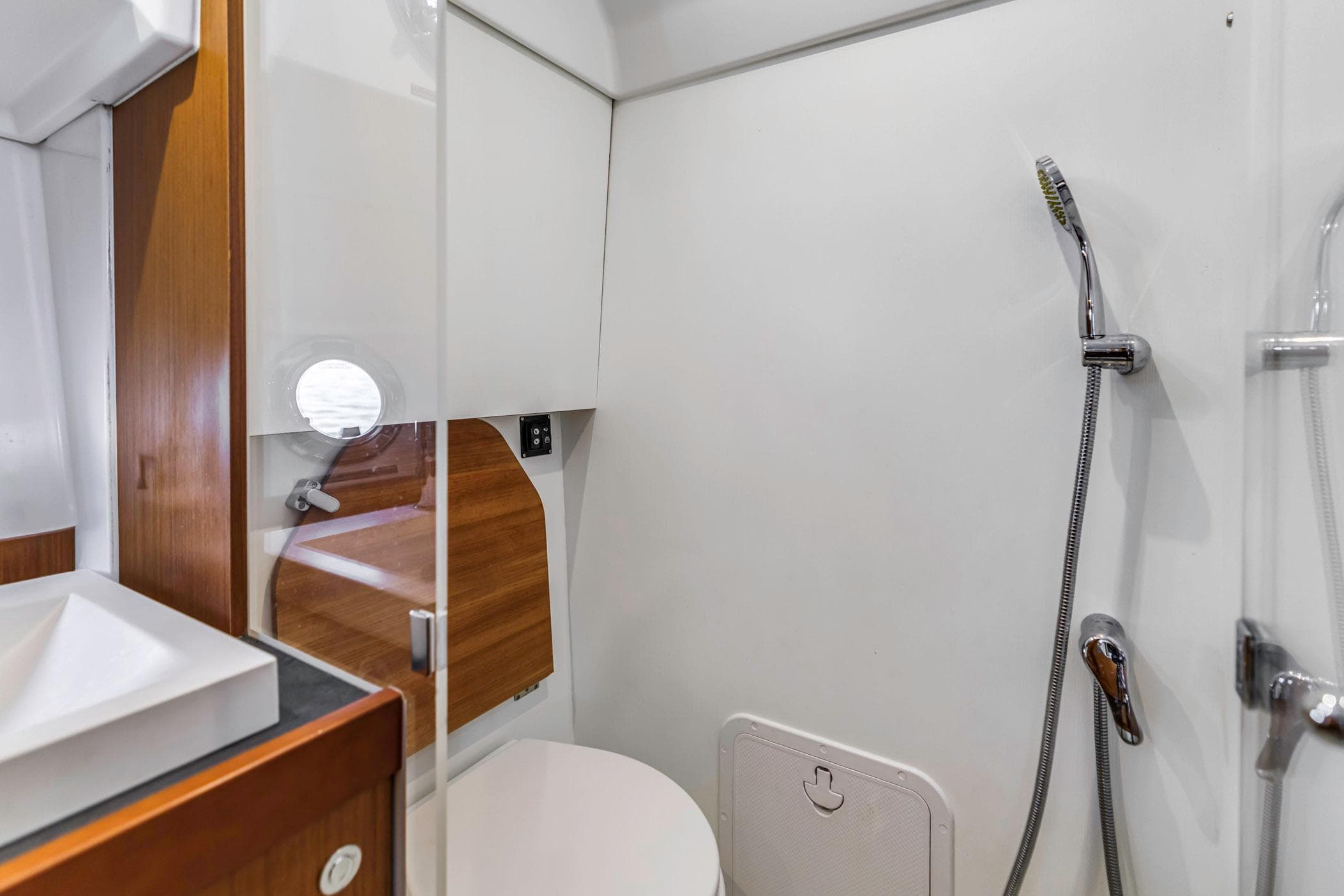 Bathroom interior of 2019 Beneteau Swift Trawler 35, featuring shower and modern fixtures.