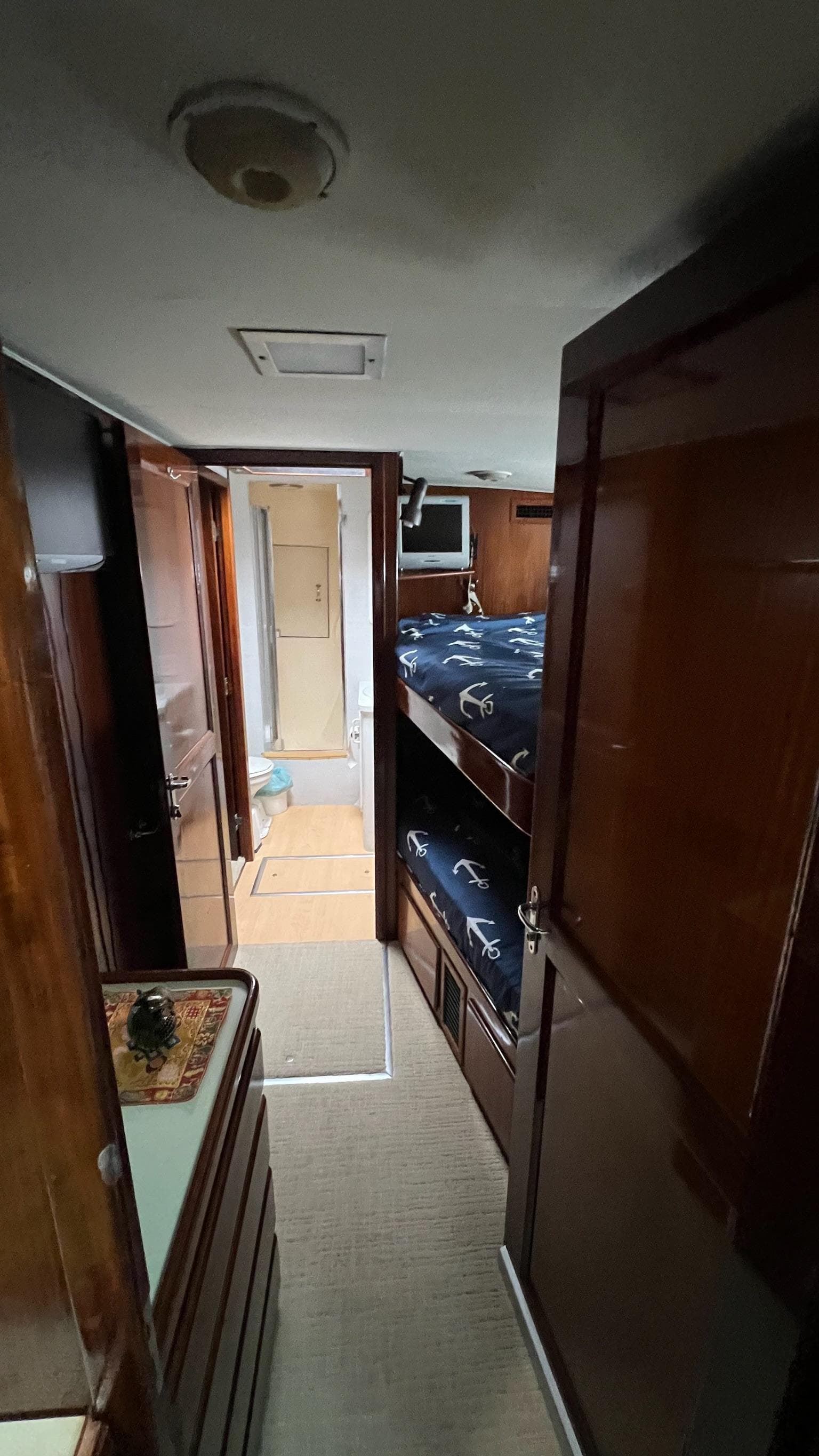 1987 Hatteras Motoryacht interior with wooden finish and bunk beds.